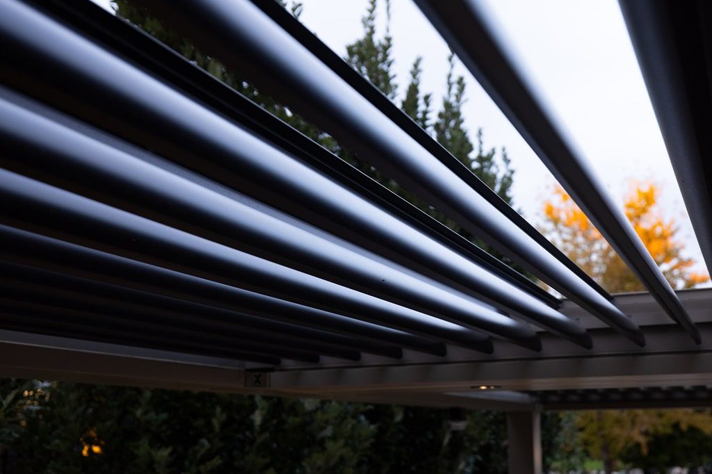 Modern pergola with motorized louvers