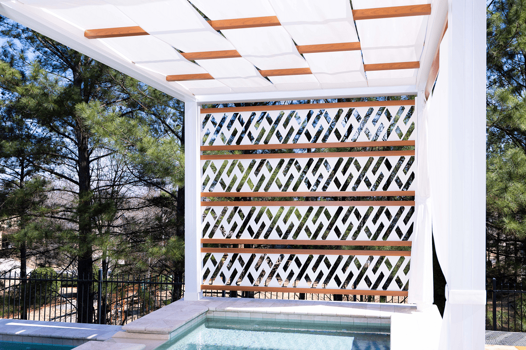 Artistic outdoor curtains and custom metal designs on pergola side panels