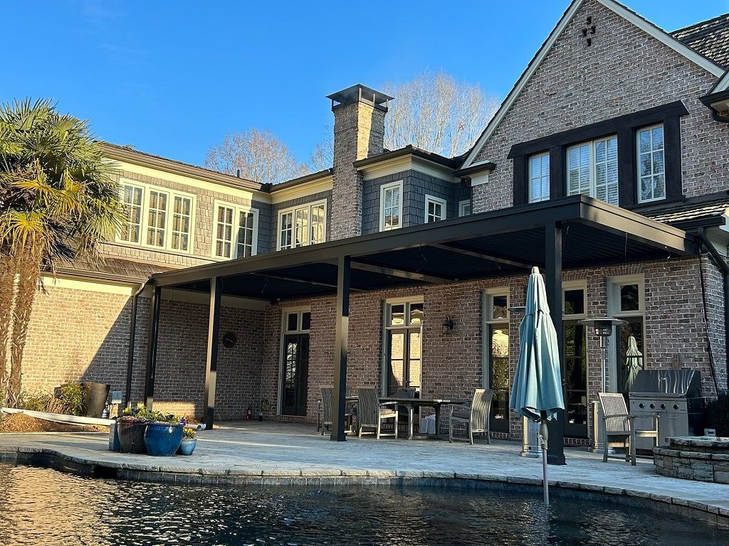 Wall mounted Pergola X over Poolside Area
