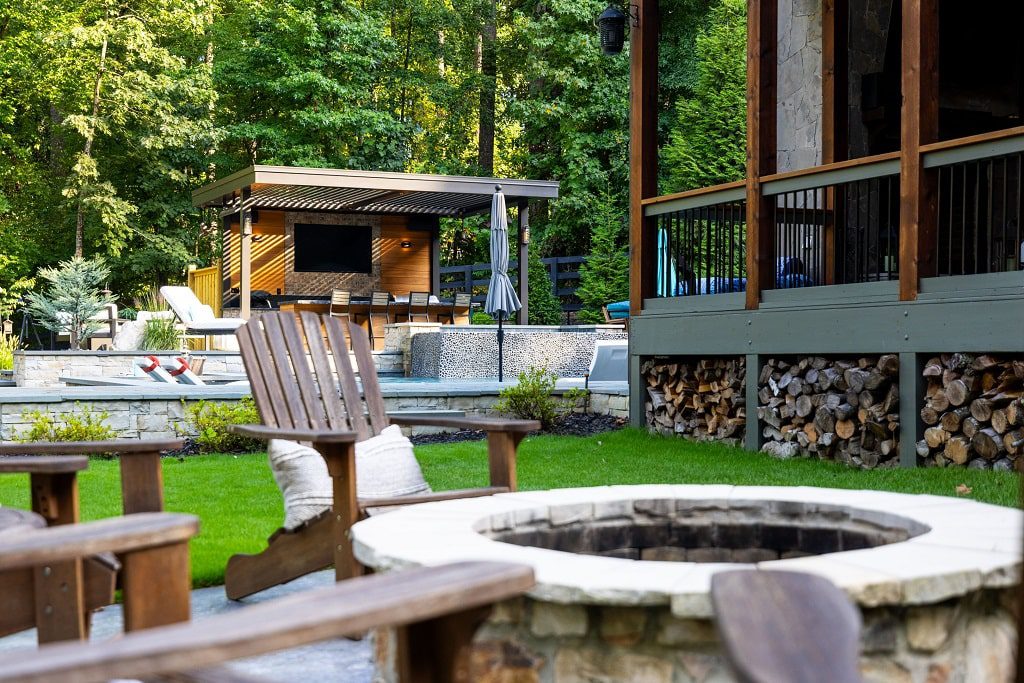 Stunning backyard with a Pergola X by StruXure providing shade and entertainment in an outdoor living space.,