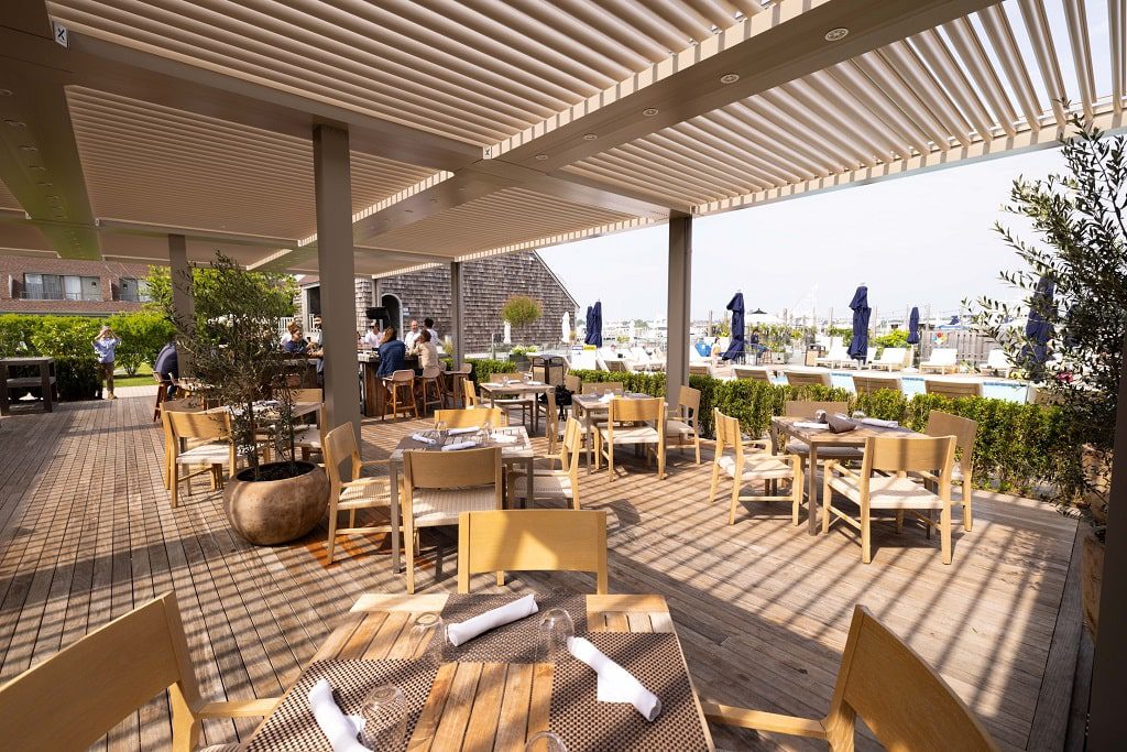 StruXure Pergola X over an outdoor seating area for commercial use.