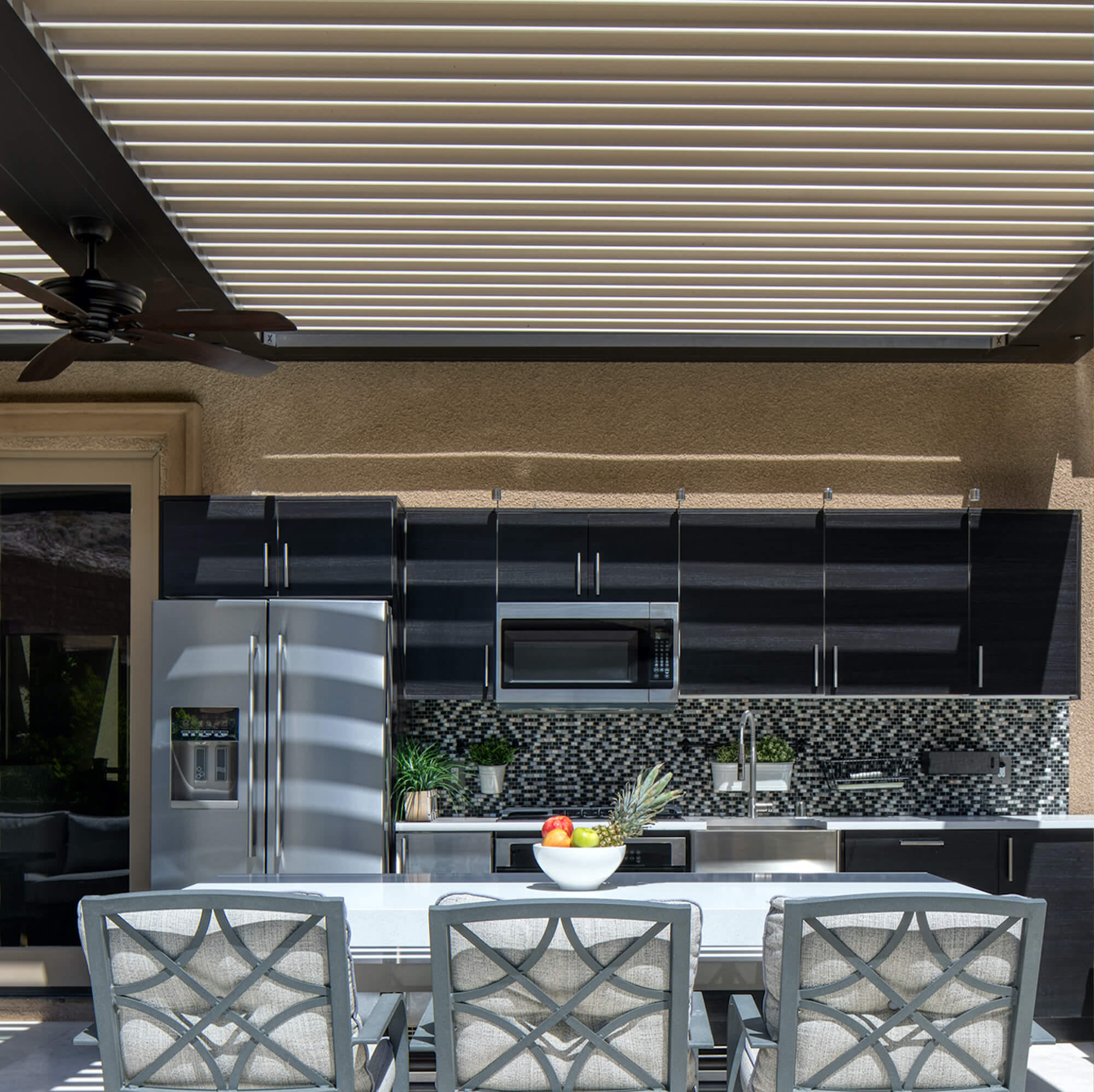 Bronze Tan outdoor Pergola dining area with appliances