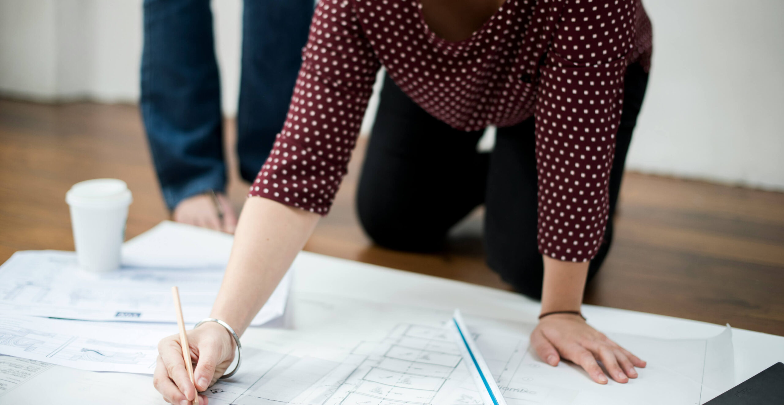 Person creating a plan on paper.