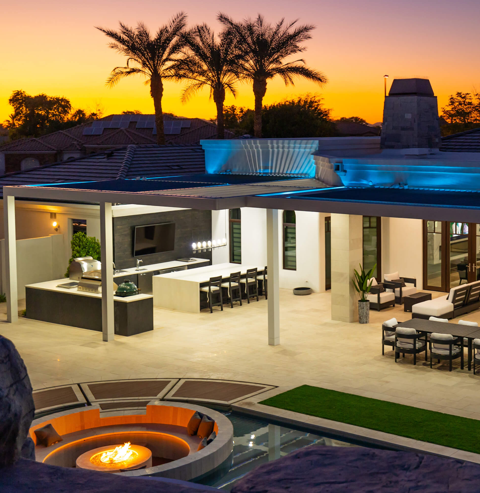 Backyard patio area with a firepit.