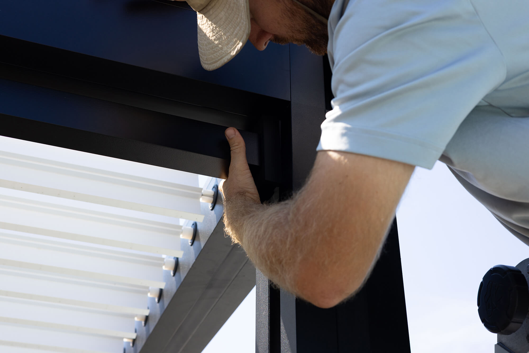 Person installing a pergola