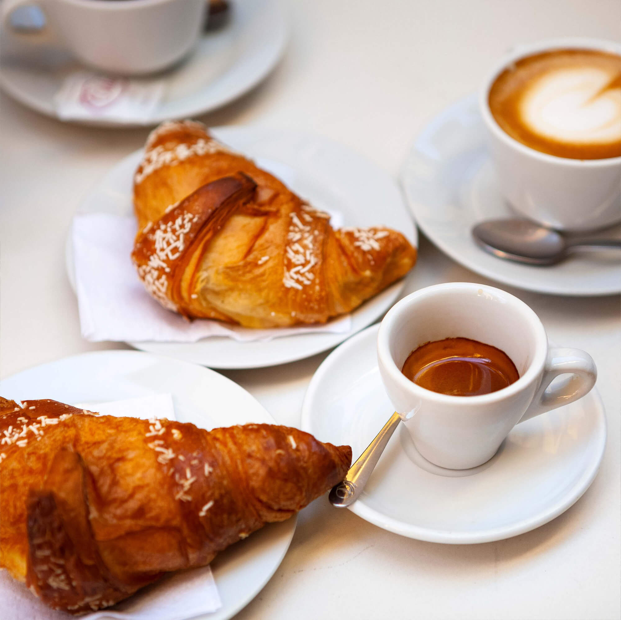 Croissants and tea set on a table