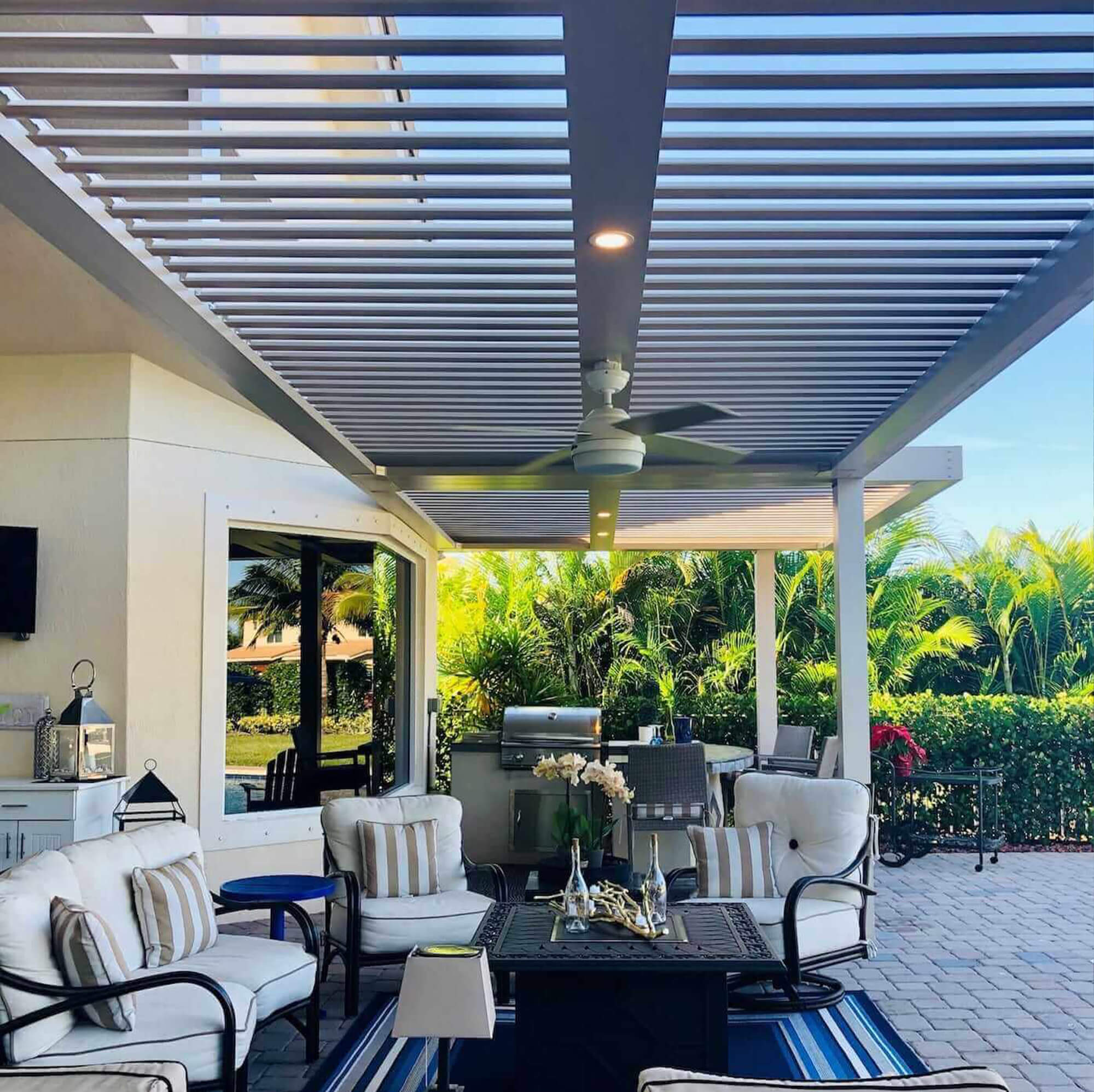 side view outdoor extension Pergola with kitchen appliances tables and chair