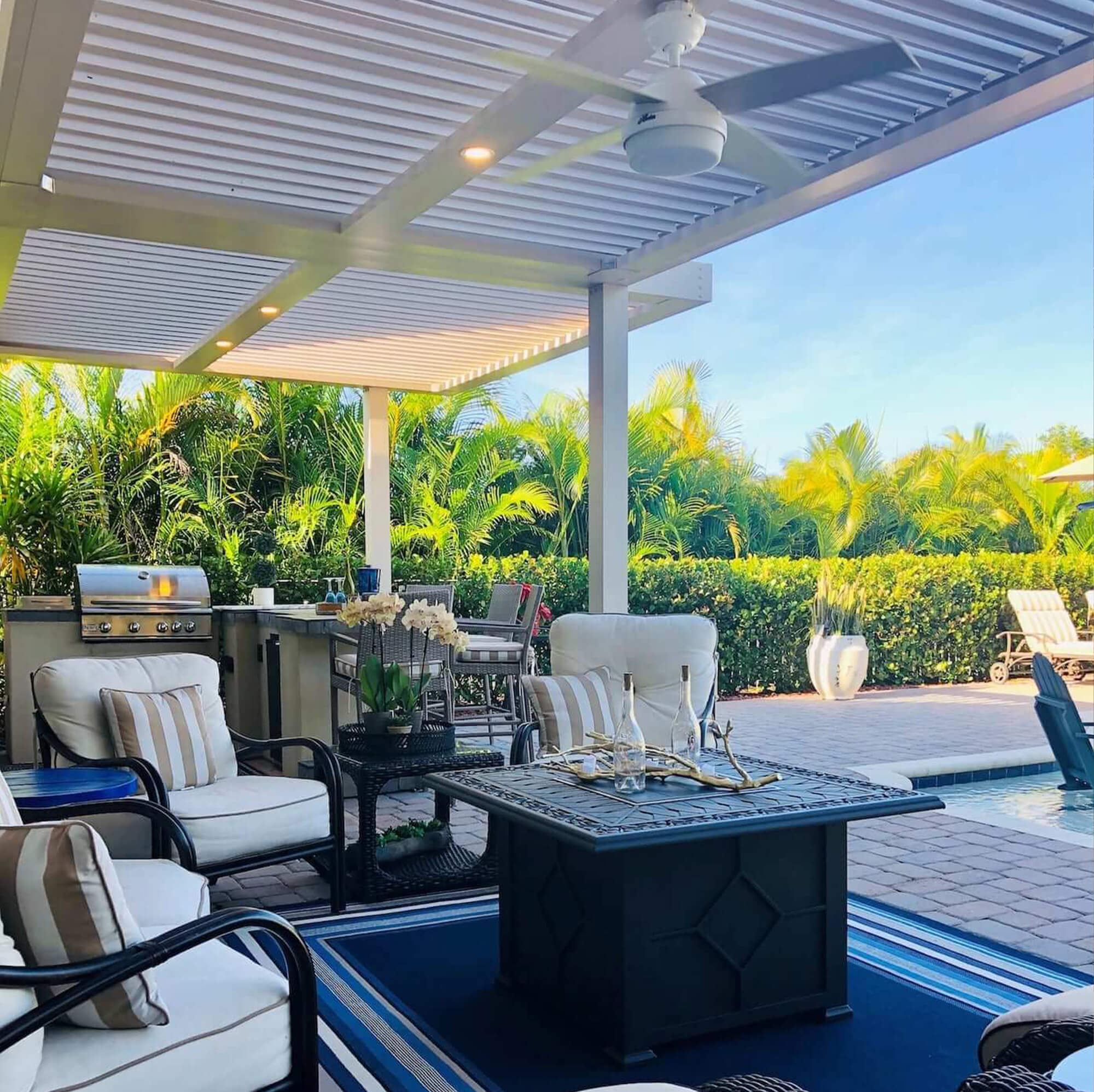 outdoor extension pergola with kitchen appliances tables and chair