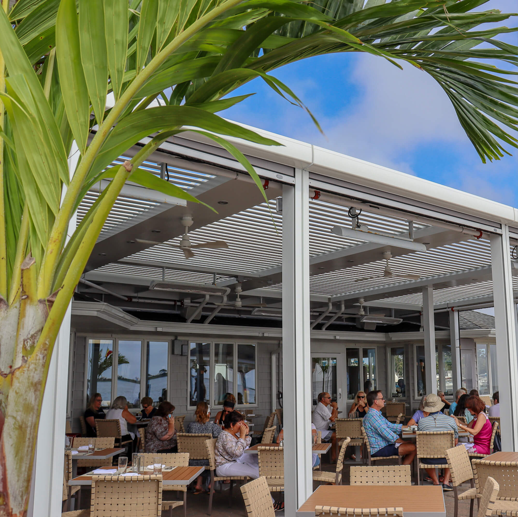 Restaurant outdoor Pergola view while people busy eating