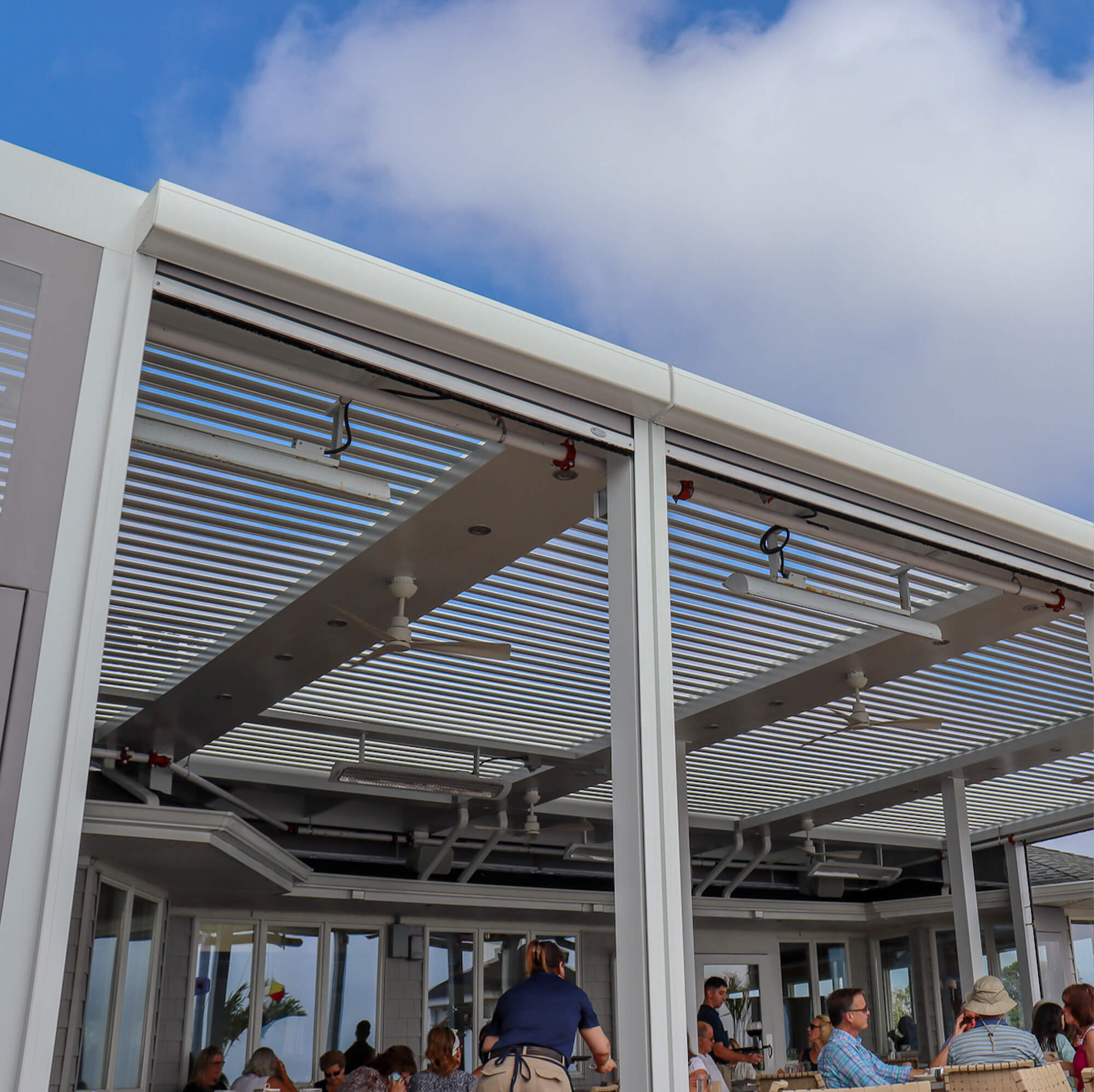 Restaurant outdoor Pergola eye level view while people busy eating