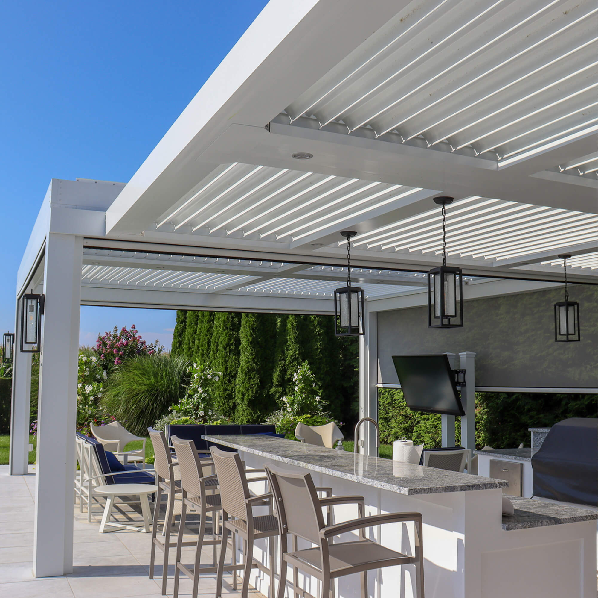 white outdoor canopy with hanging lights in the middle