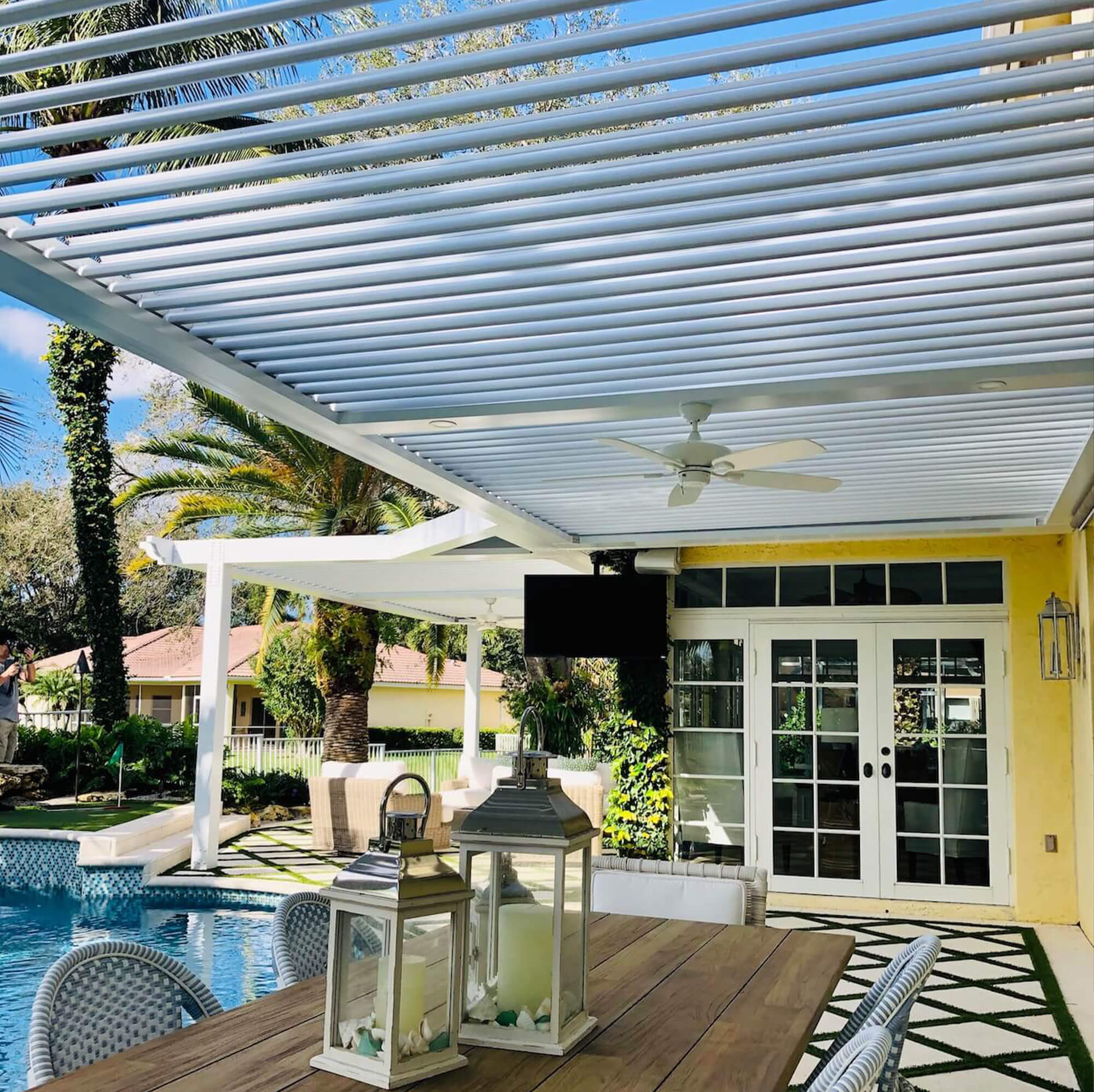side view white outdoor Pergola with grass trim and tiles
