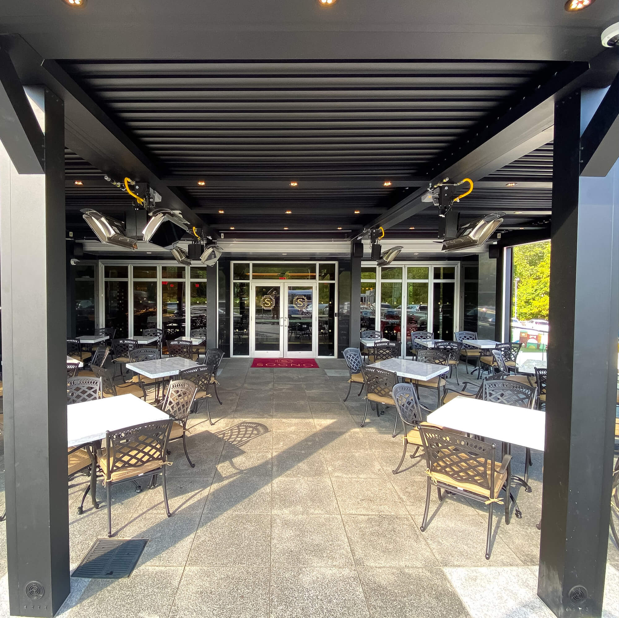 Front view outdoor pergola Sogno Restaurant day time