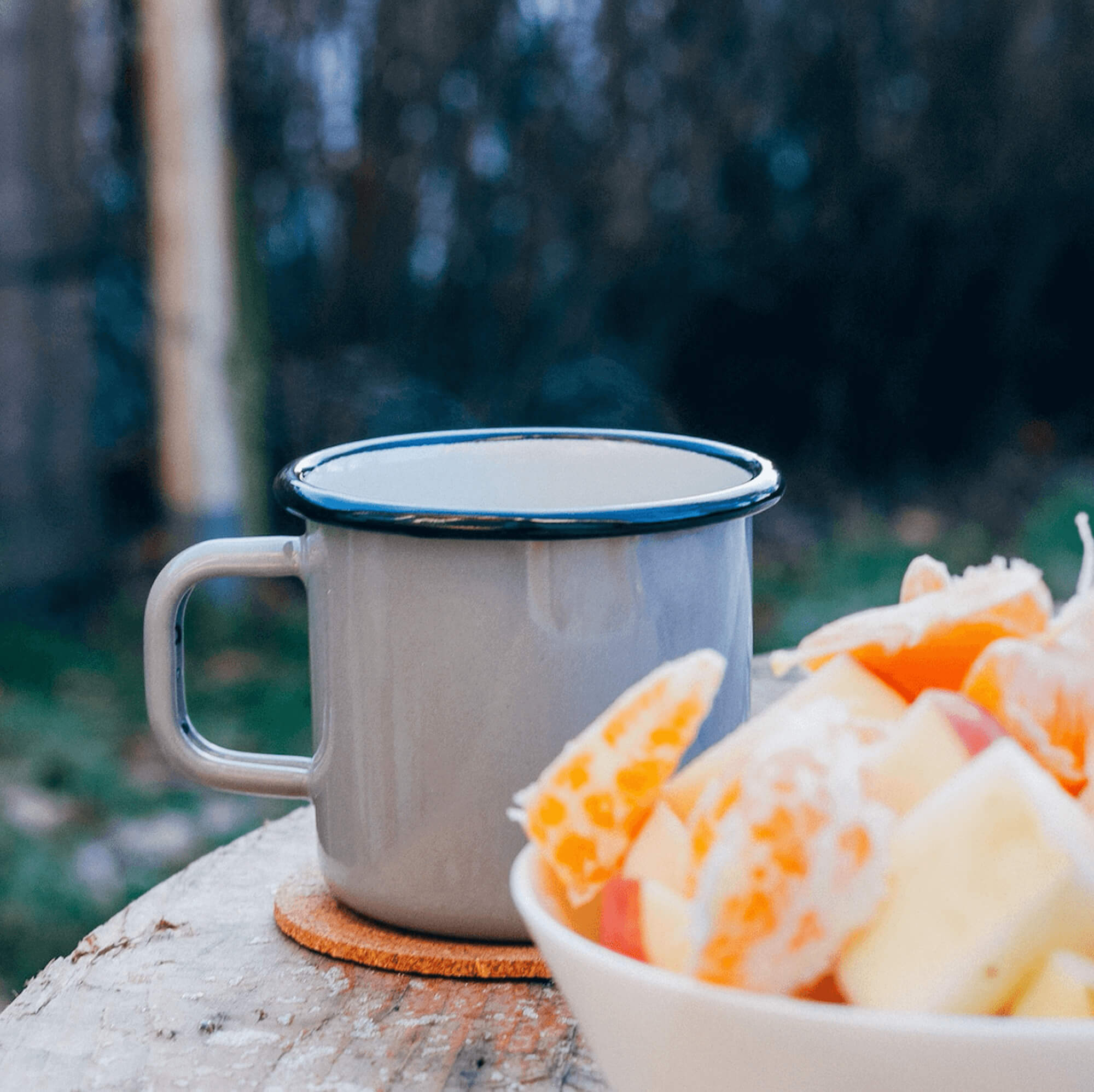 white mug and oranges