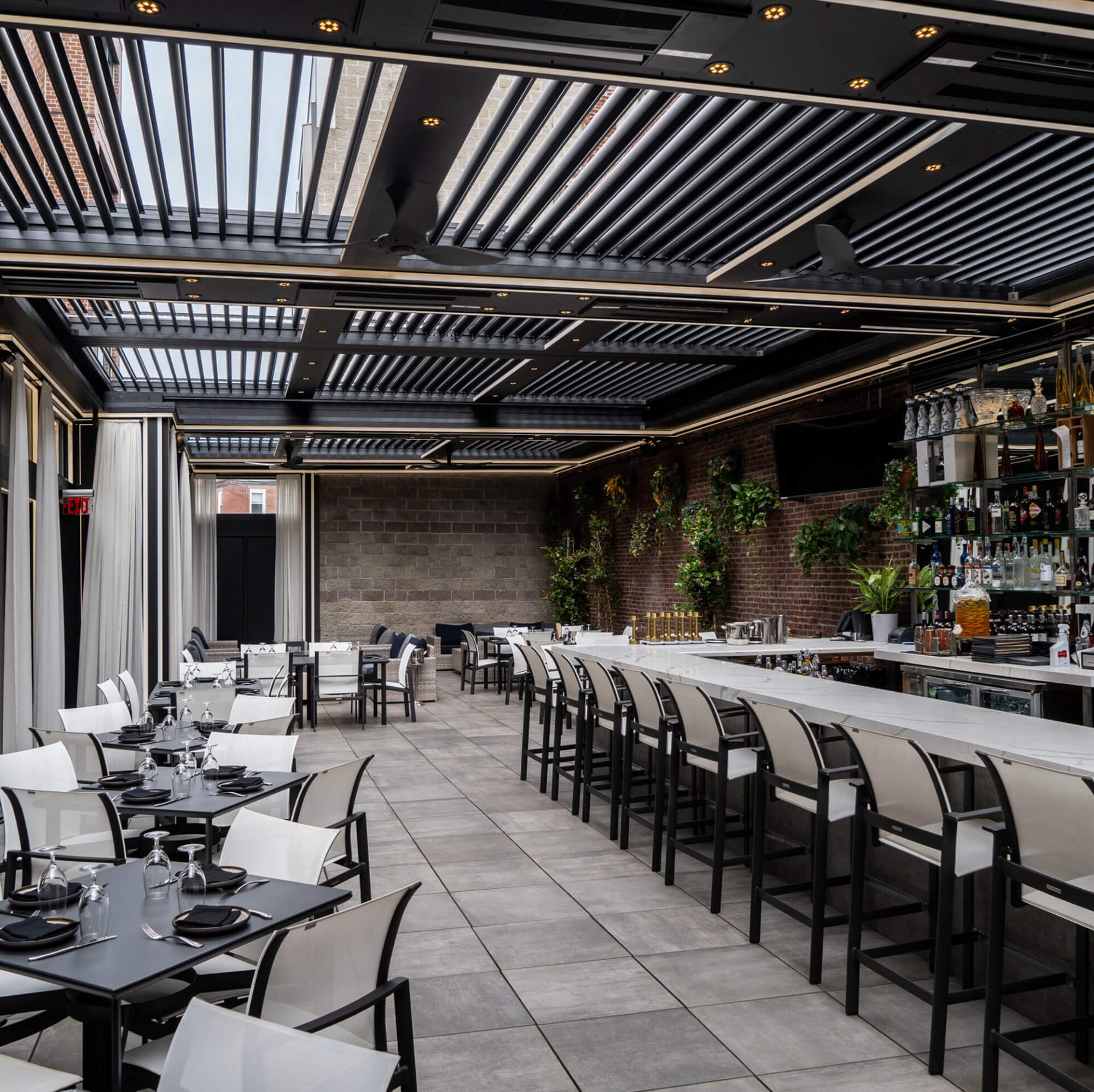 A full view of the bar area and step stools.