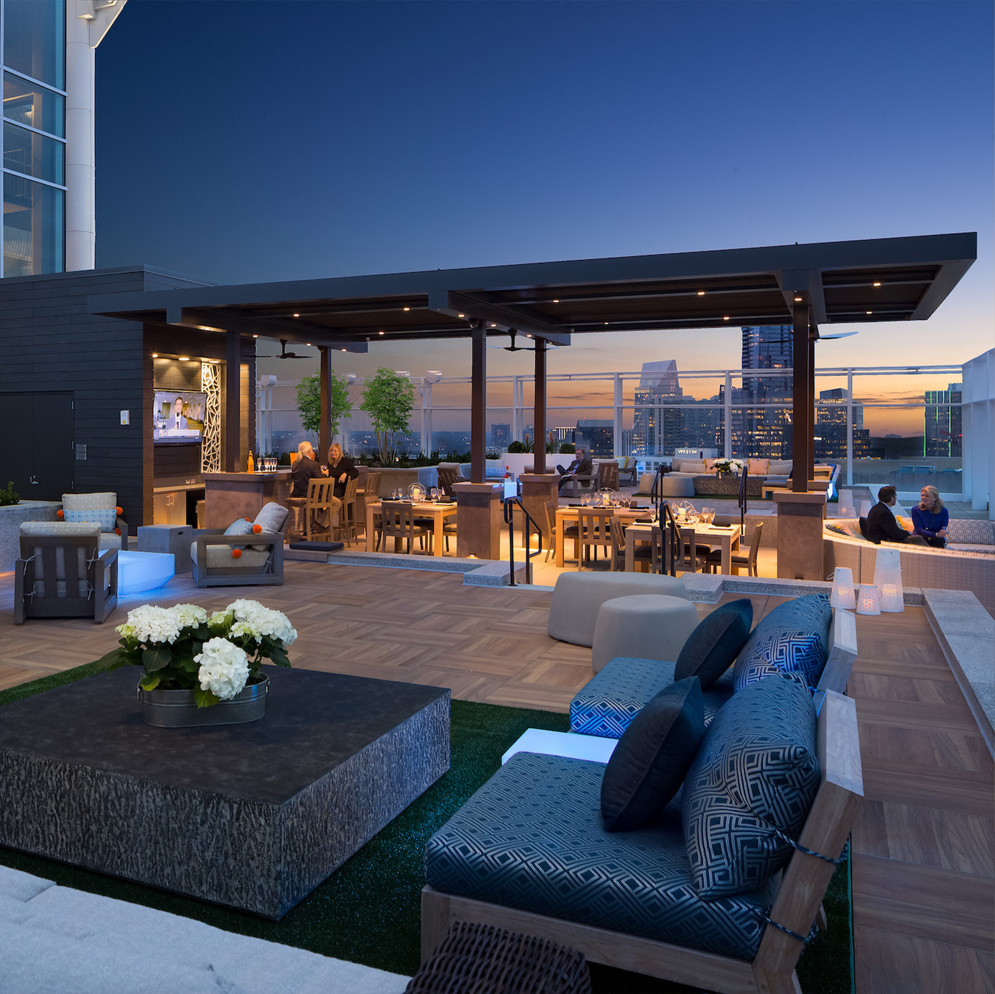sunset view sky deck outdoor black canopy and dining area facing city
