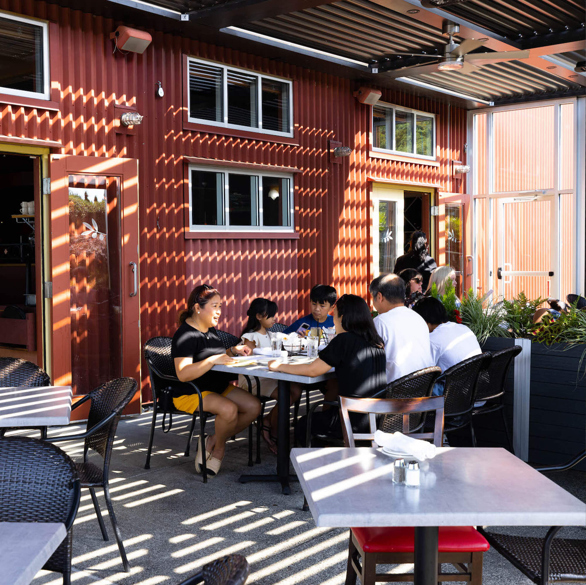 family picture of family eating outdoor of restaurant