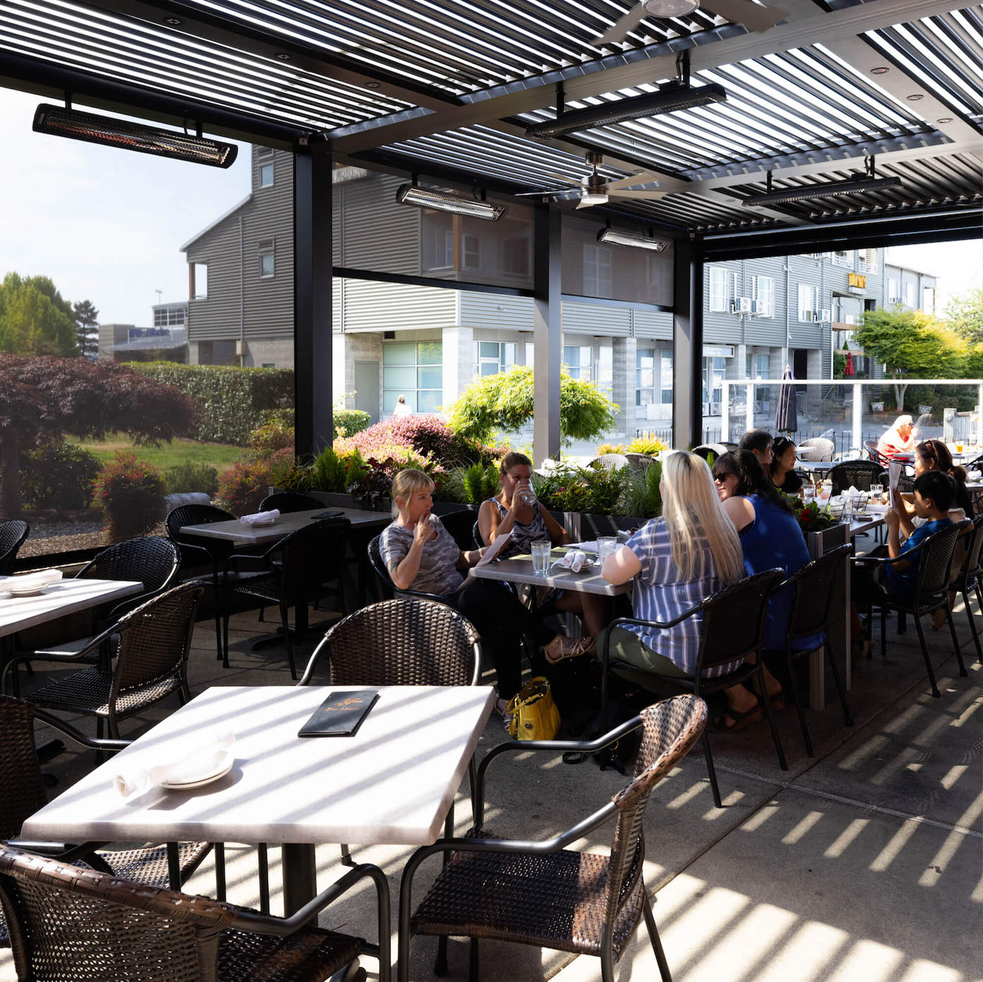four woman sitting beside the family outdoor restaurant