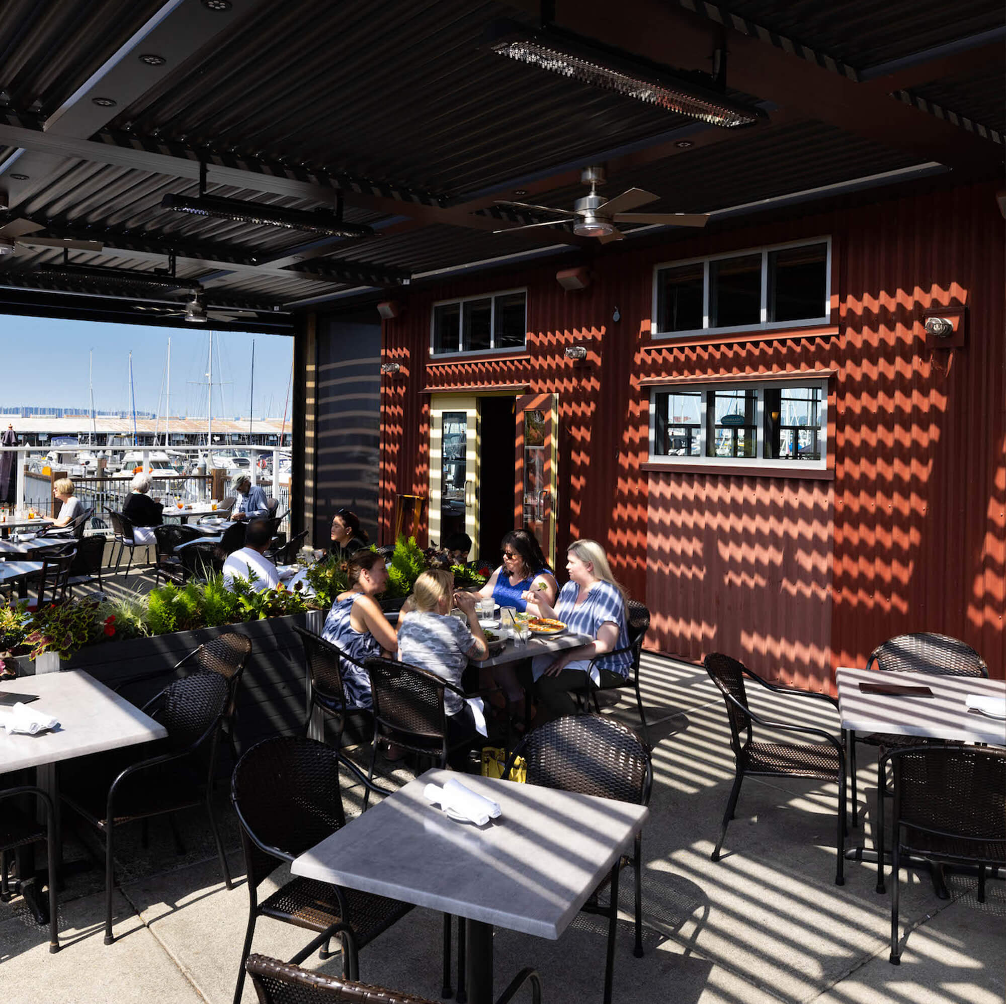 four woman eating together in the restaurant outdoor place