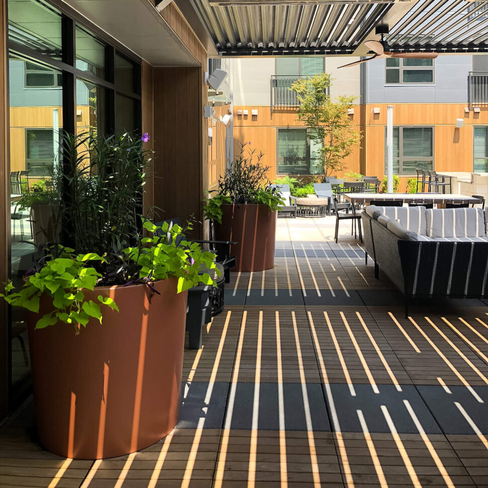 outdoor canopy shaded with brown big pot and plants