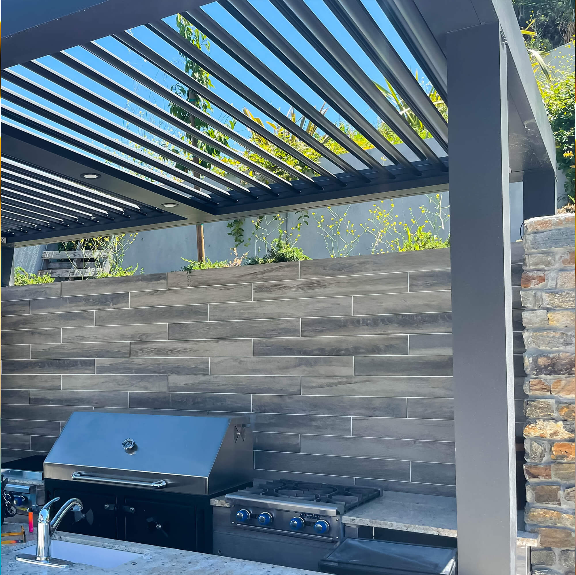 An area beside the pool to grill food for the family