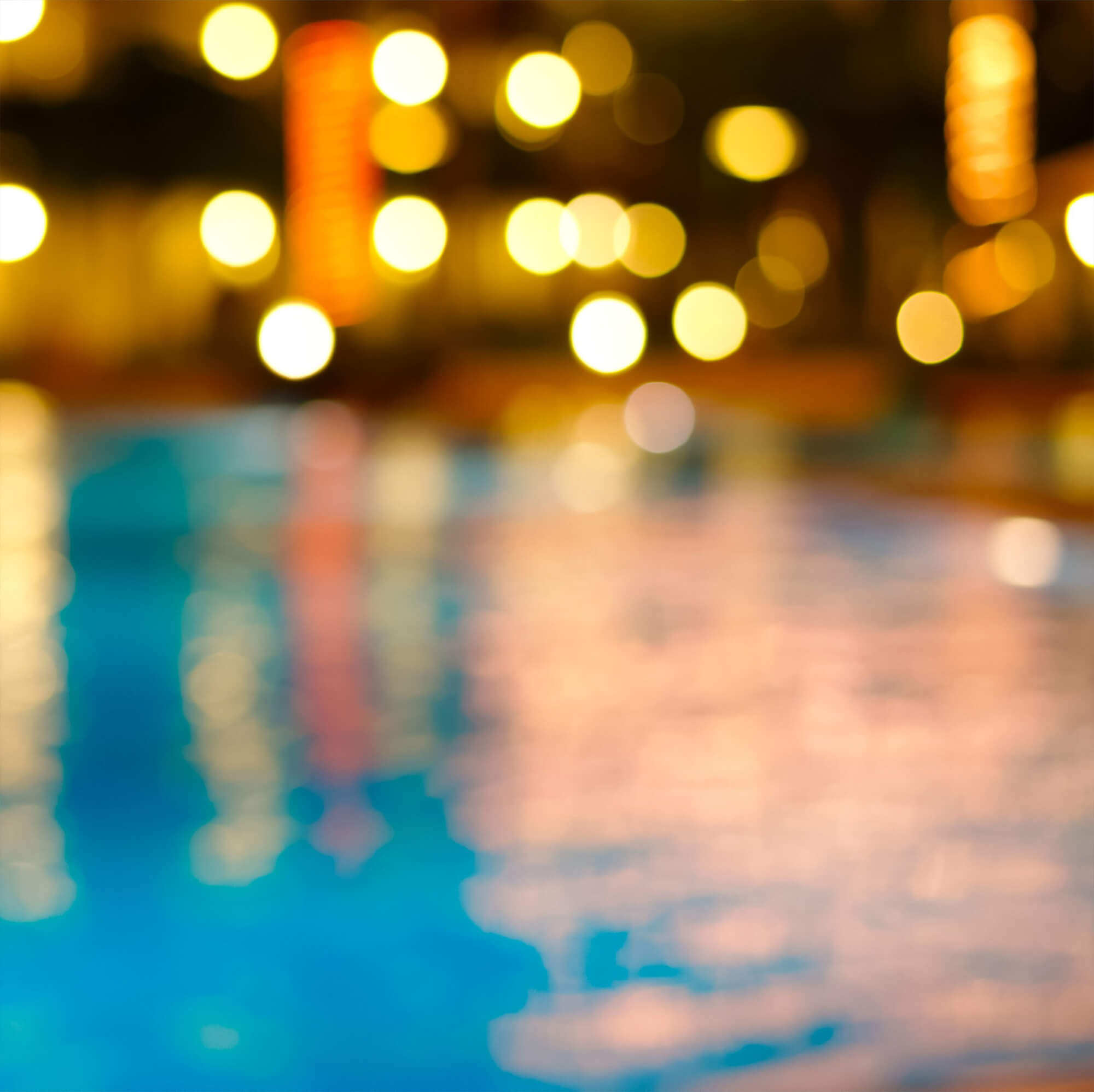 Pool of water reflecting lights within the background