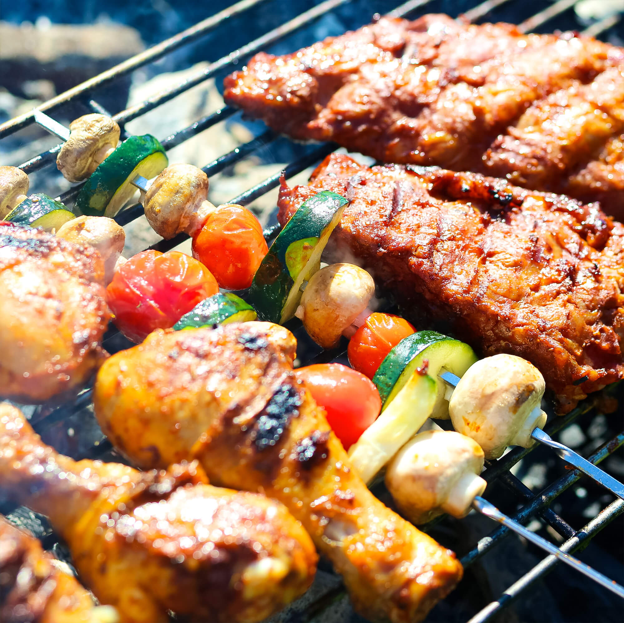 Meat and vegetables being grilled