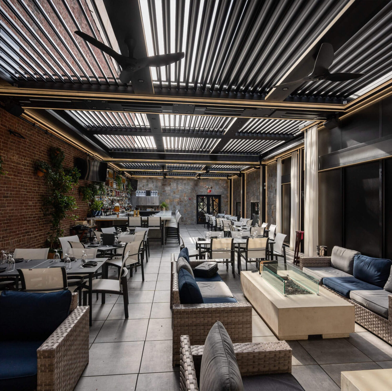 Outdoor bar area with brick walls showcasing the rest of the bar.
