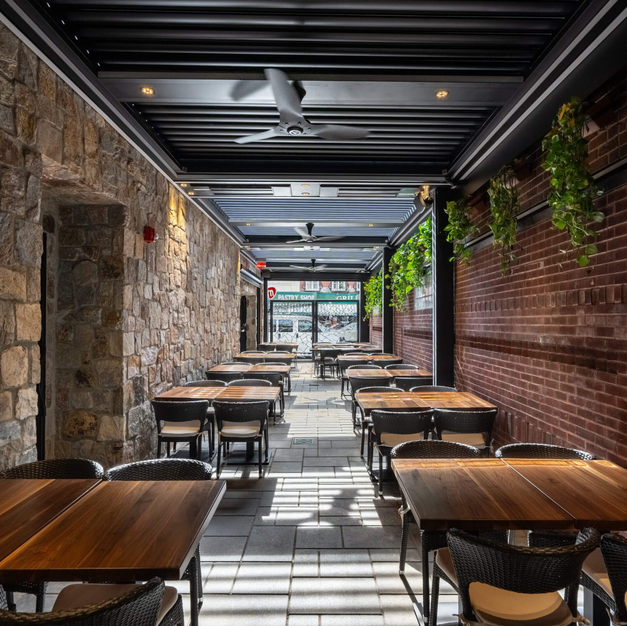 The outdoor area providing shade to the seating area.