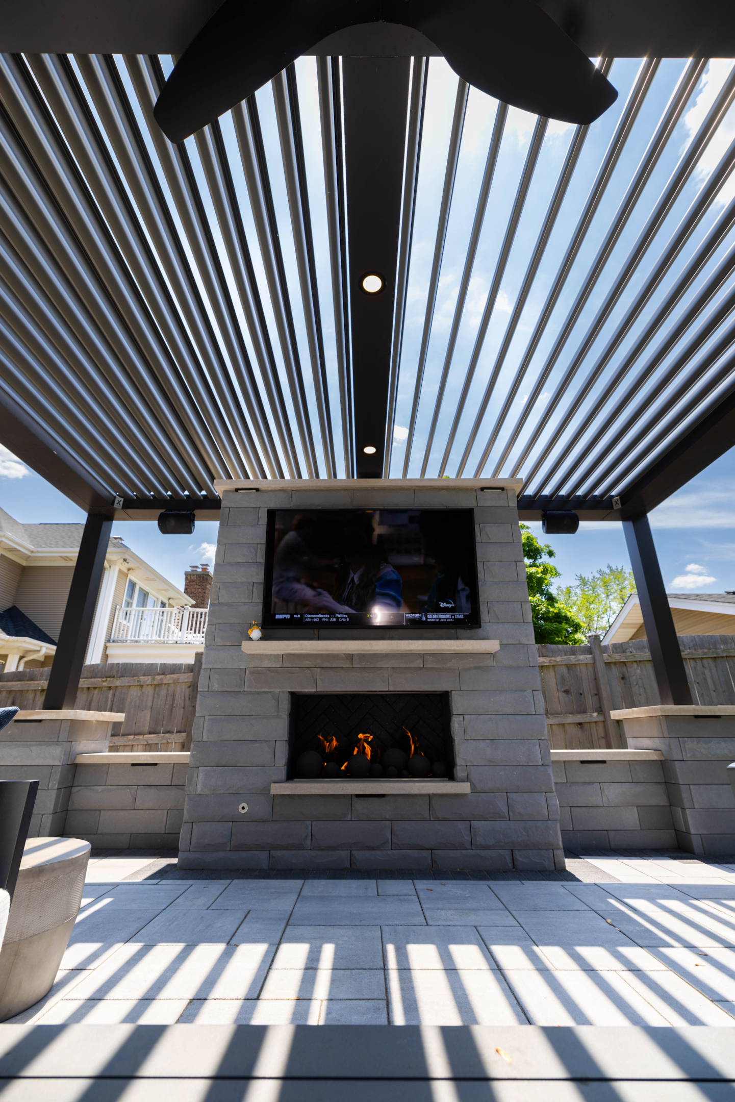 Accessorized pergola with additional features for outdoor enjoyment