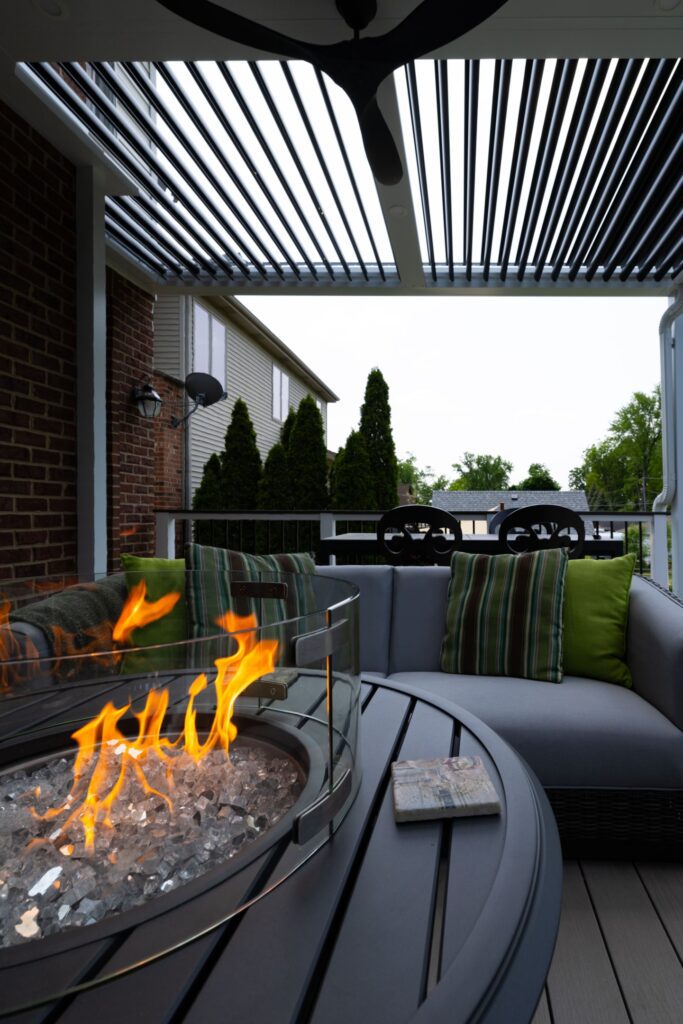 Fire pit safely under outdoor pergola 