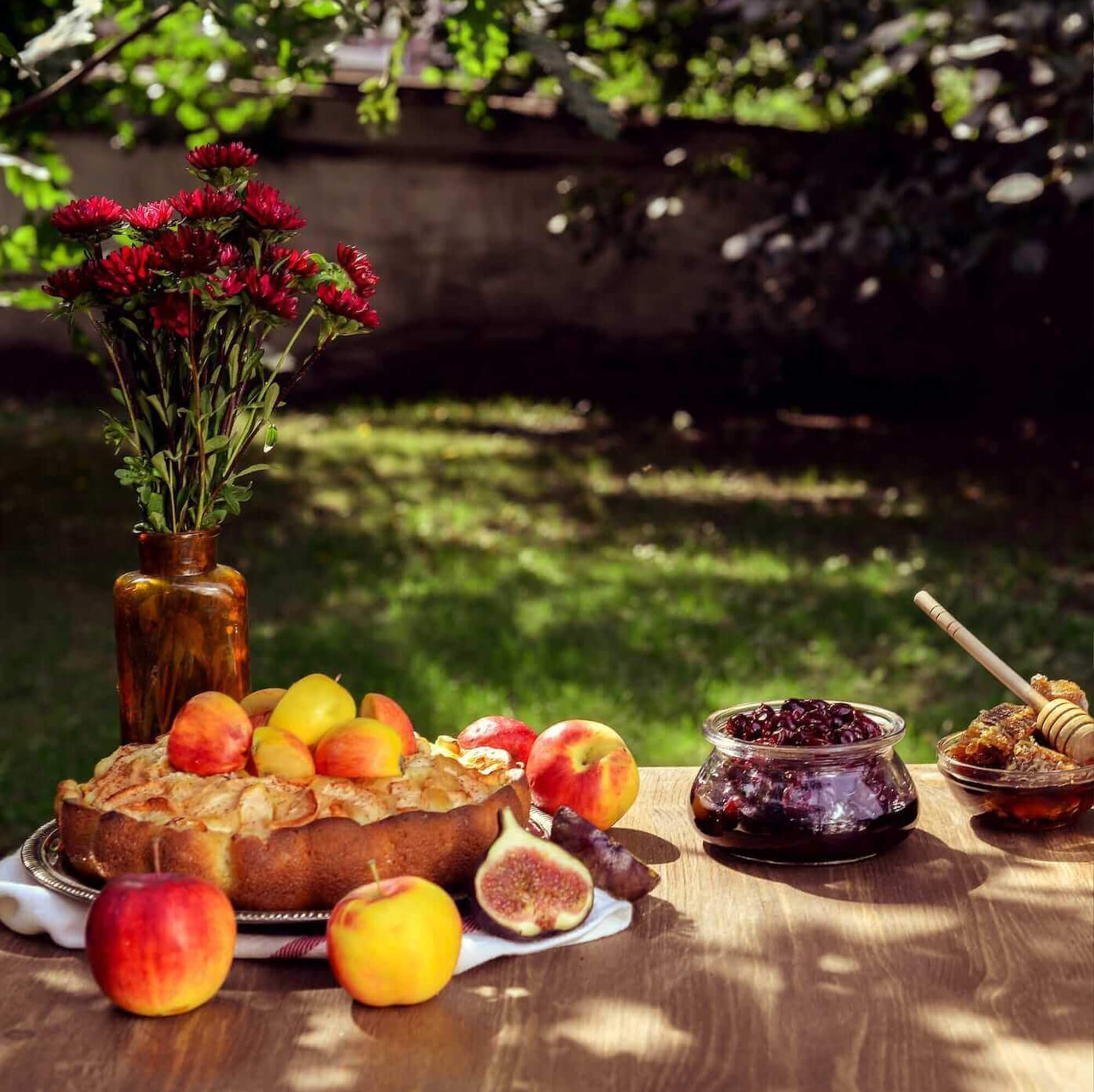wood table with apple pie apples other food and flower base