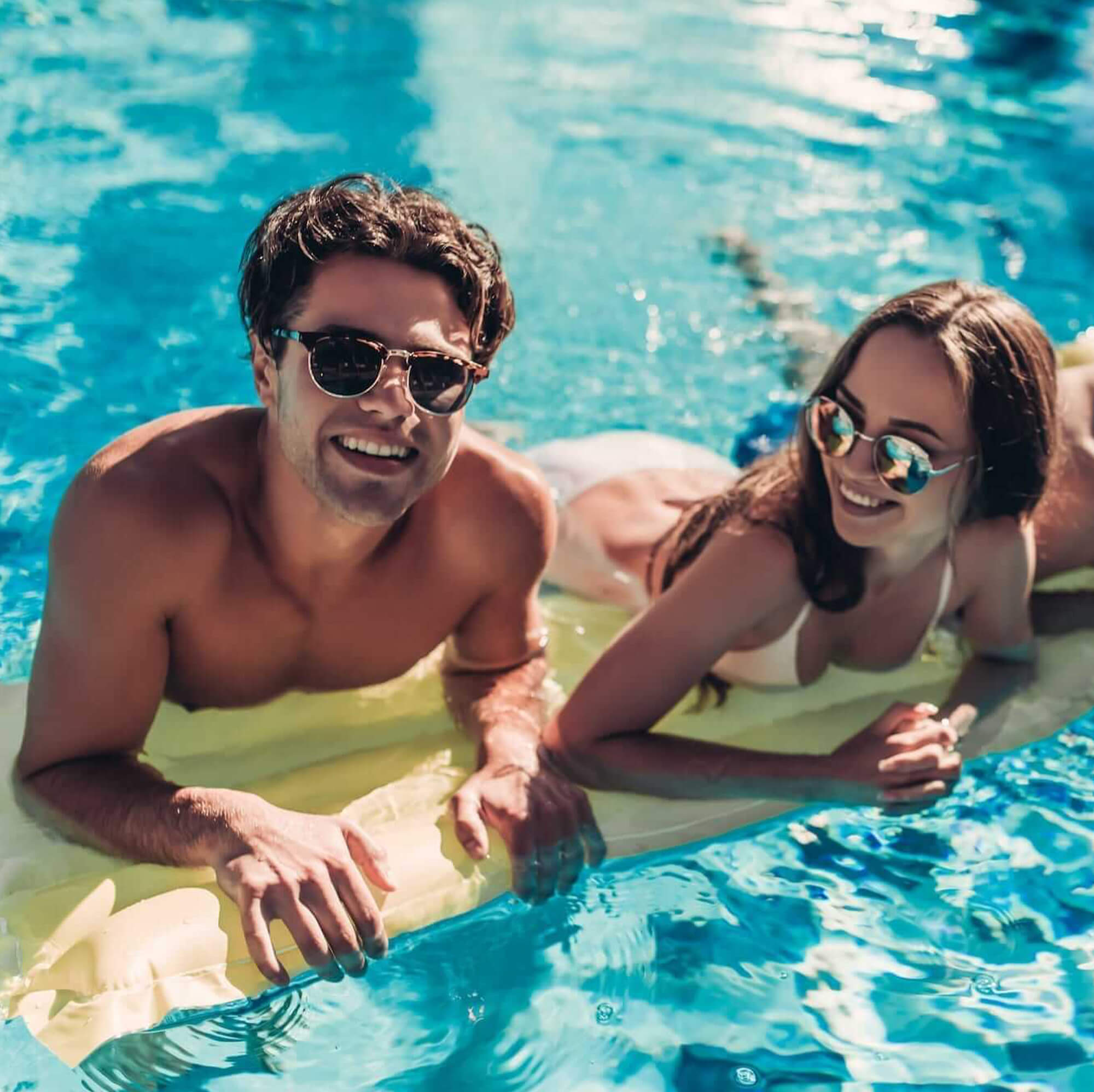 Man and woman enjoying water in the pool