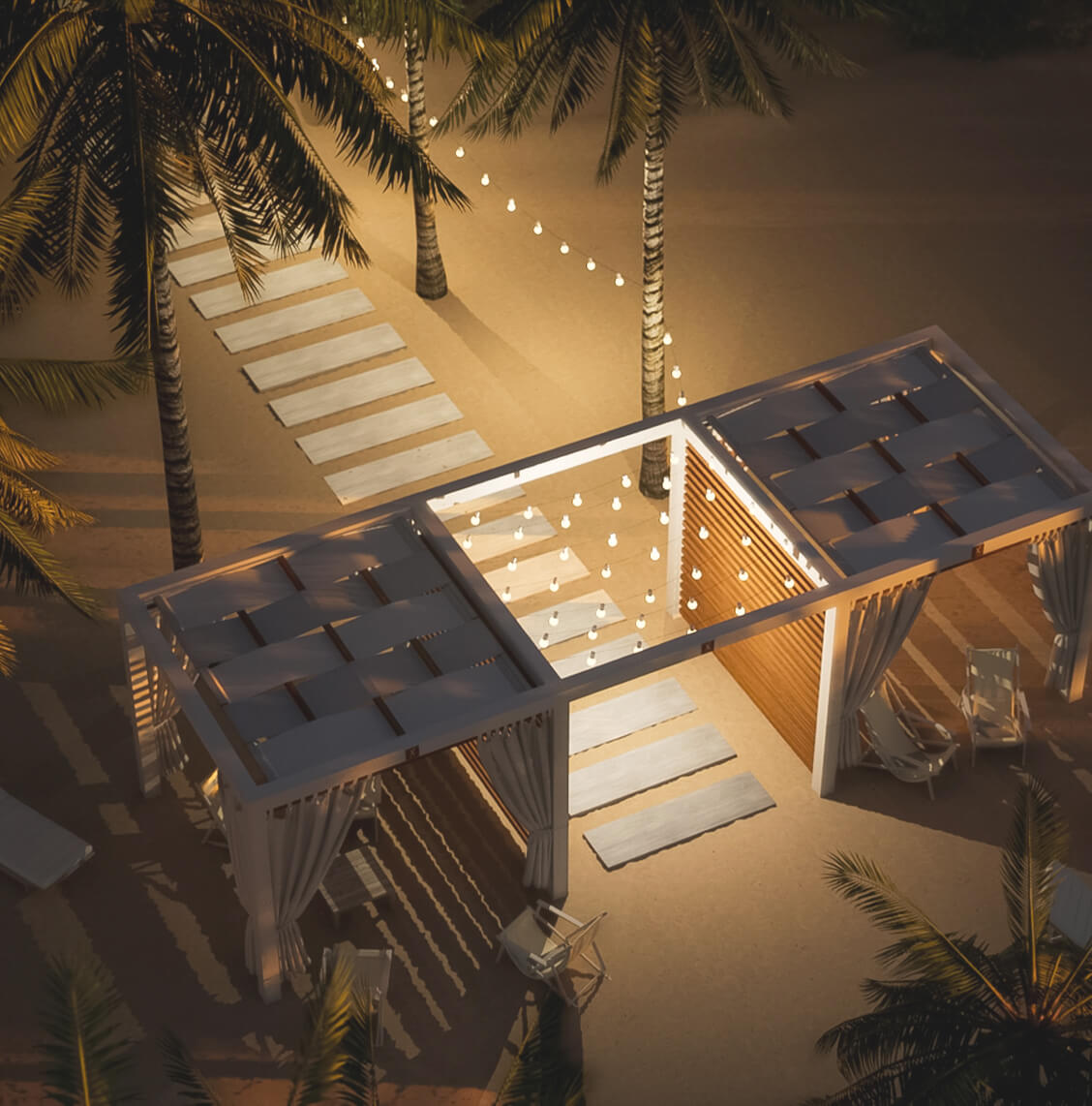 Aerial image of a cabana with lights at night