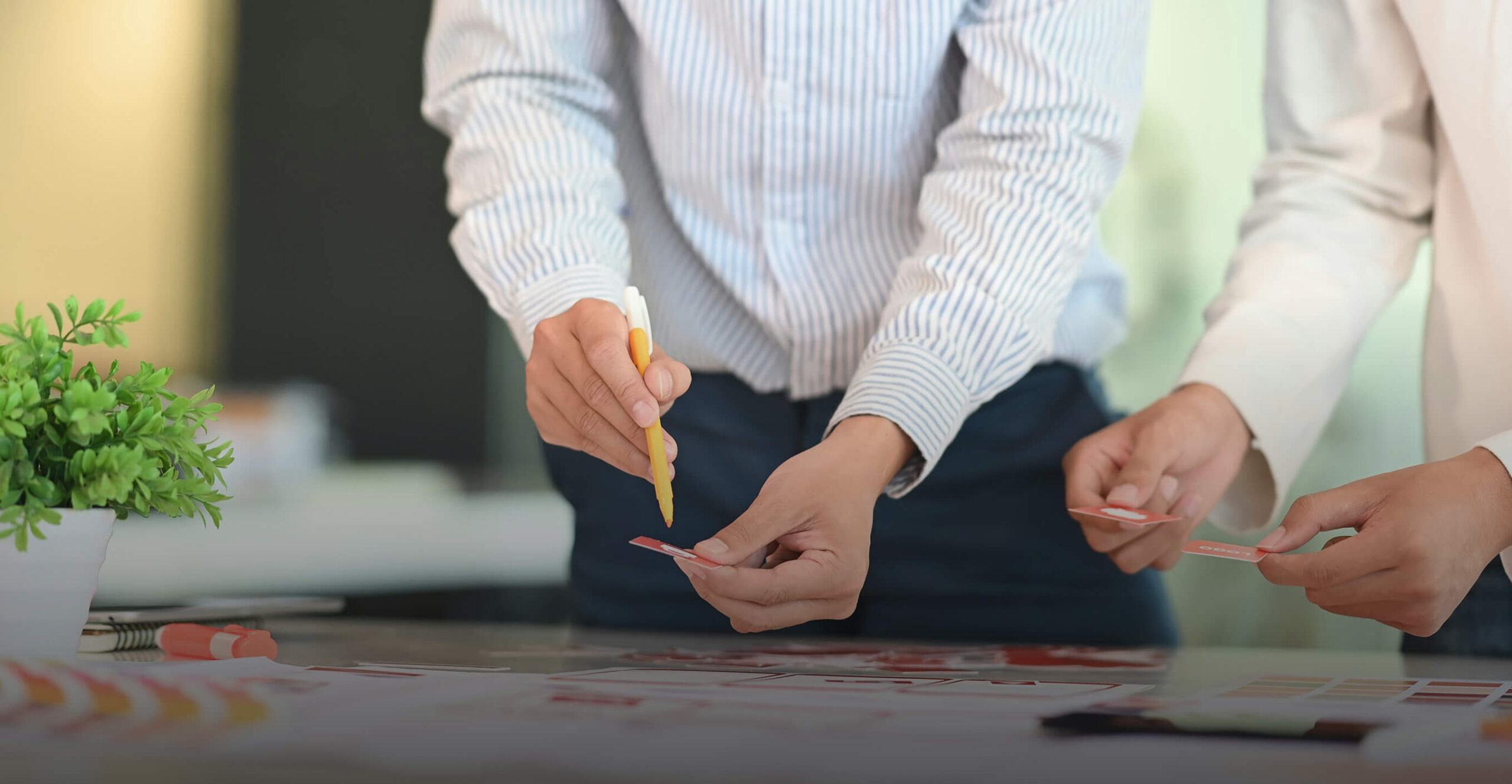 Two people working together at table