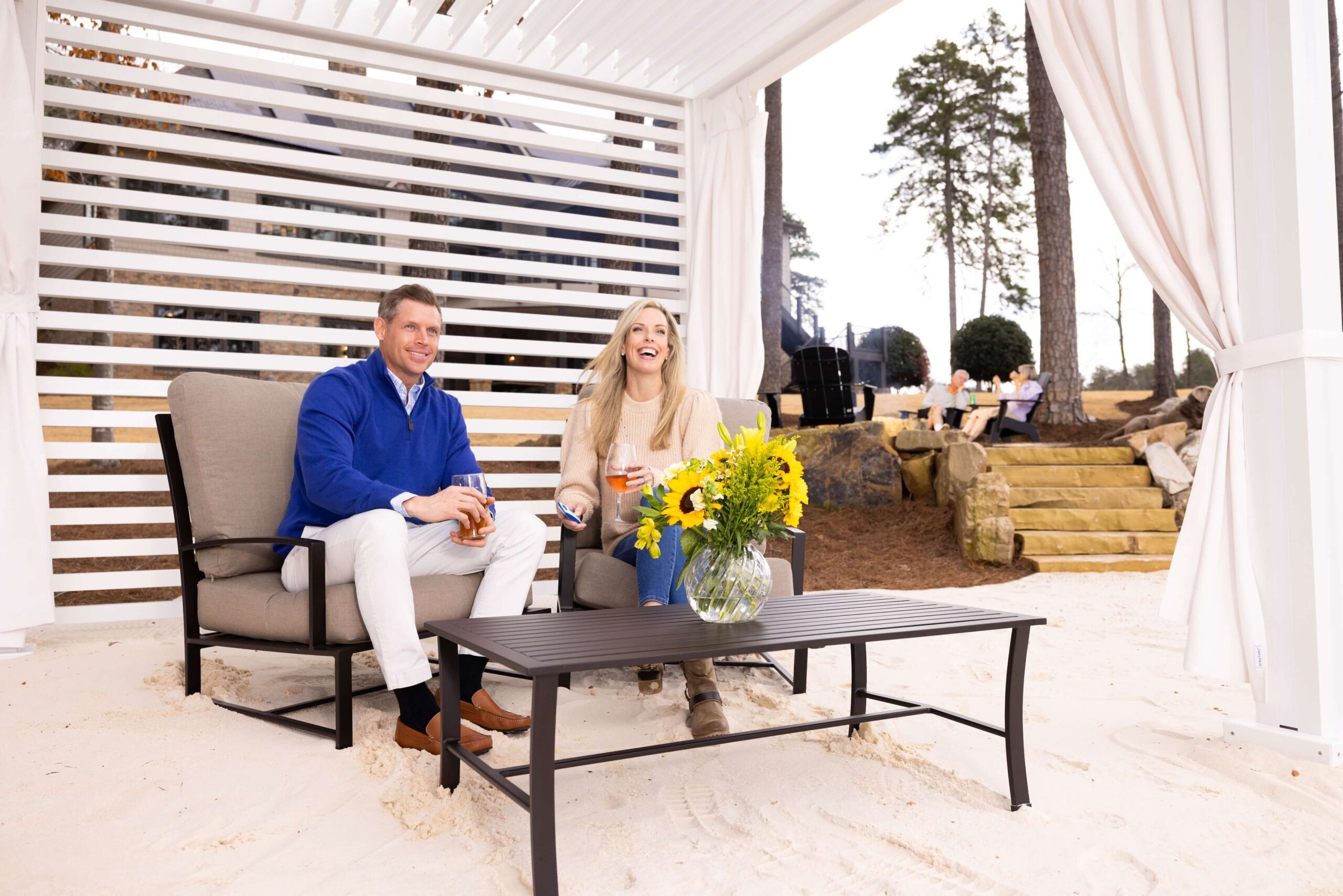 Couple sitting under a white Cabana X Core