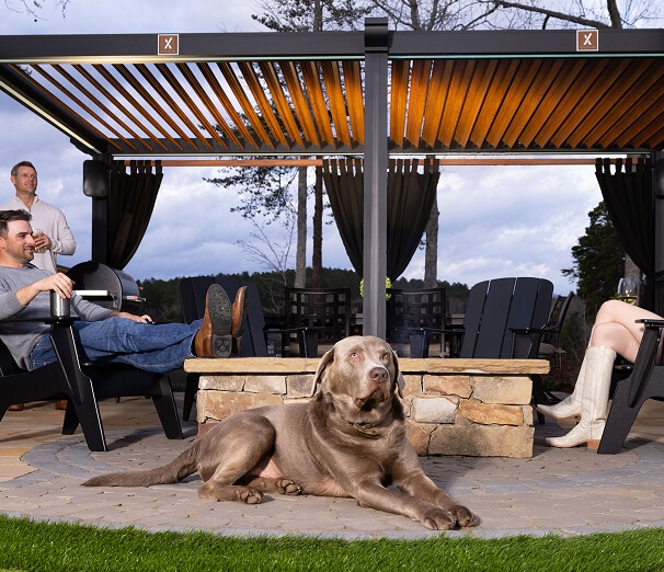 Family with dog sitting under Cabana X