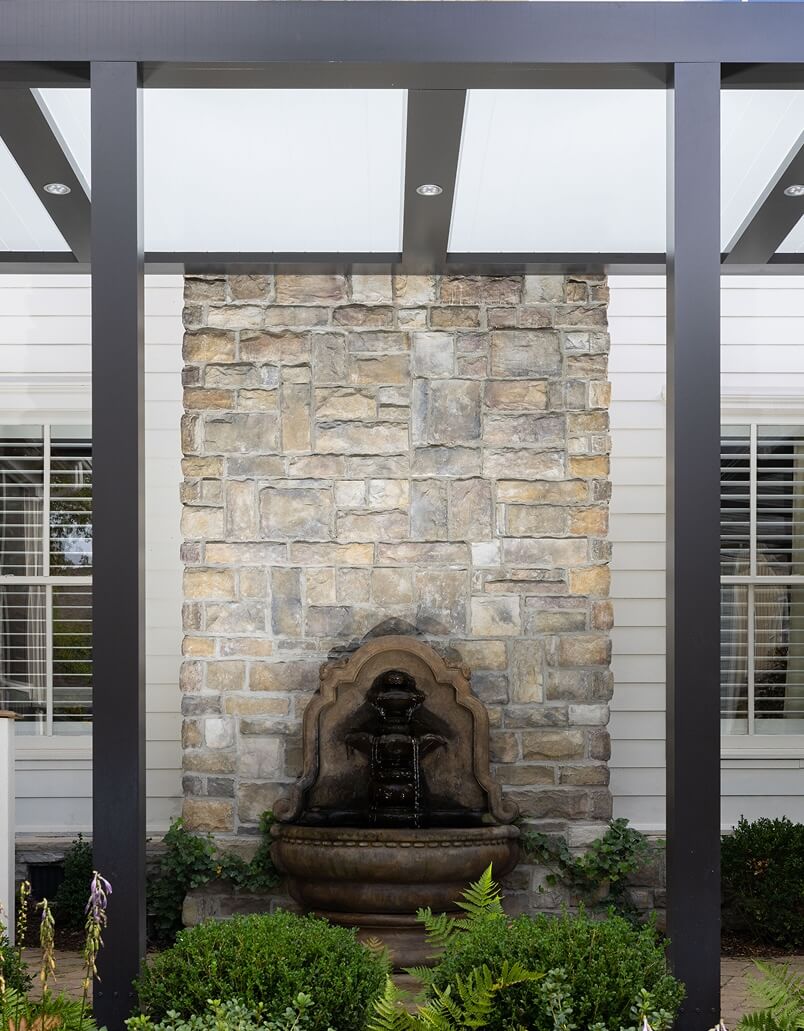 Two tone Pergola Pan 6 over an outdoor fireplace