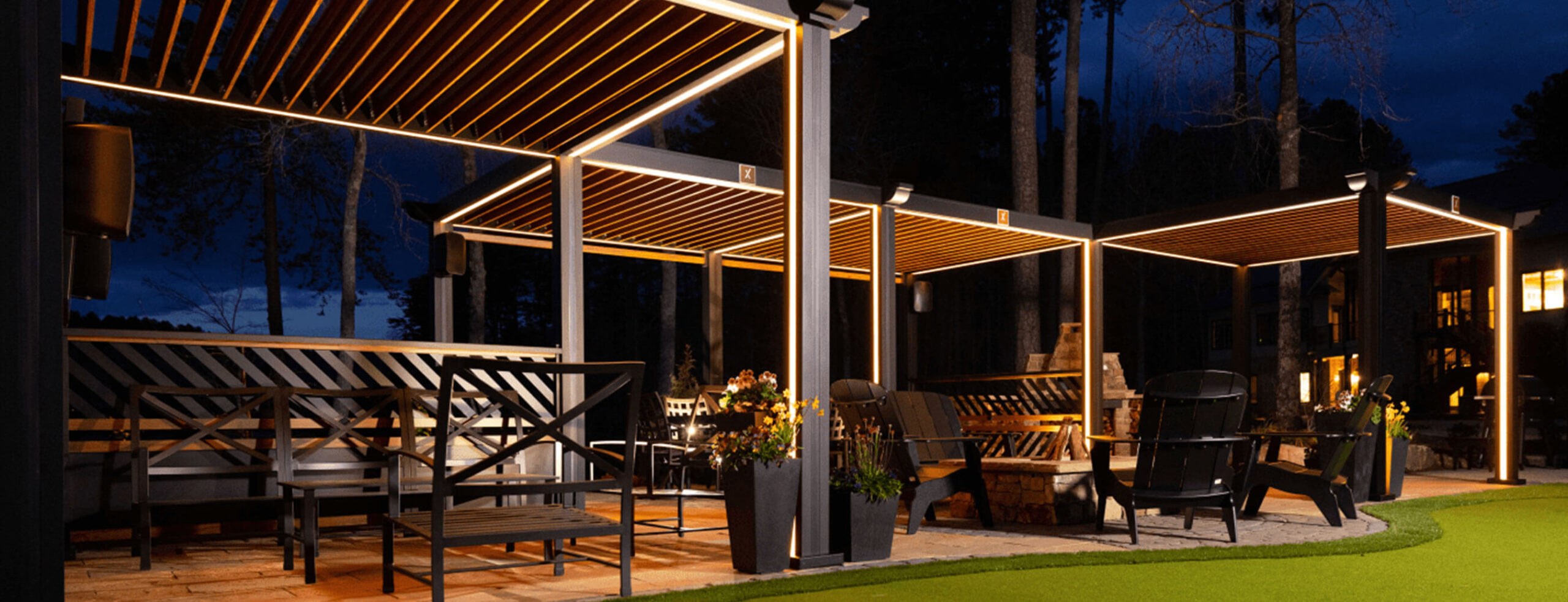 Cabana X Mod C shaped design with lights at night time