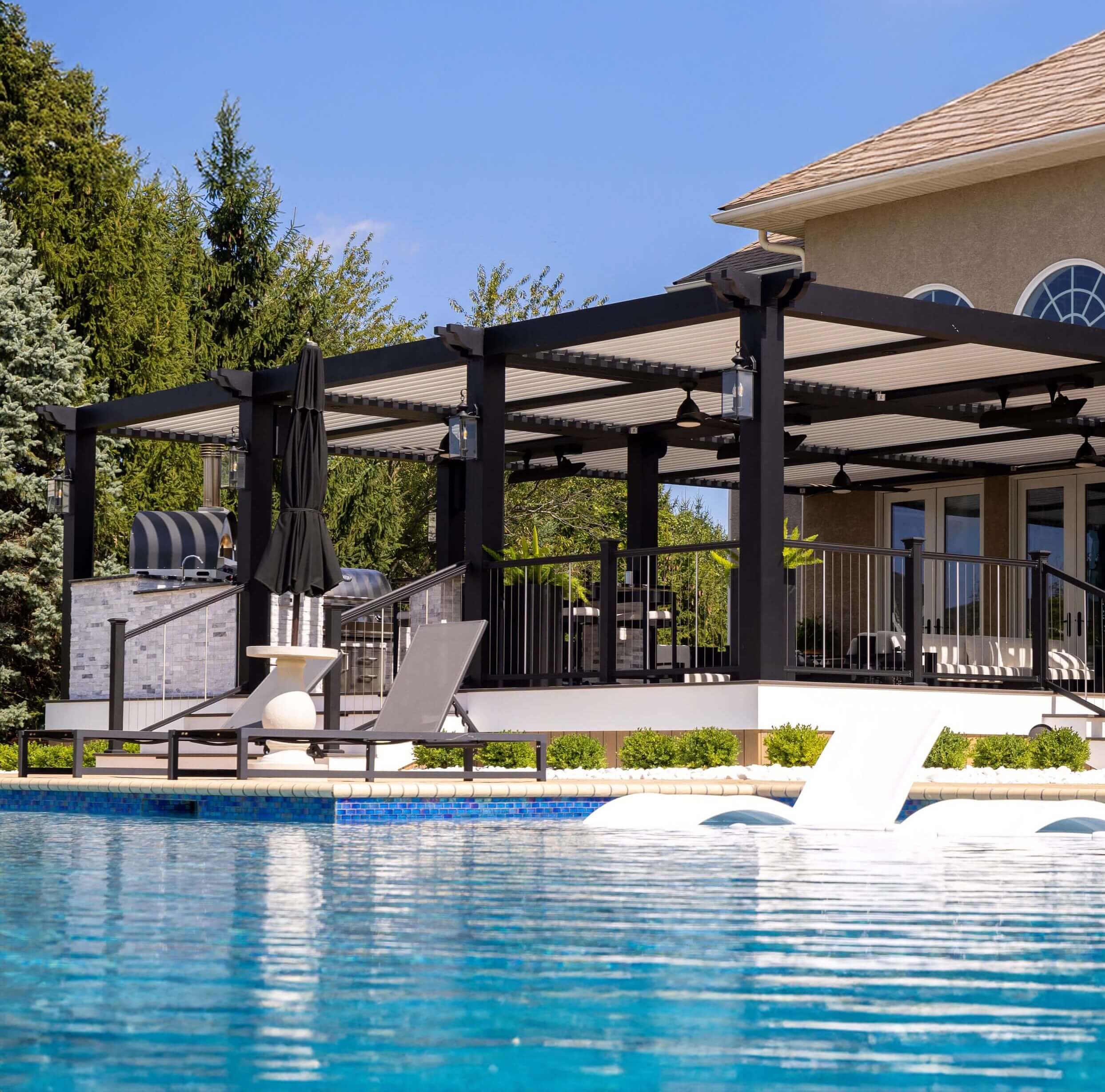 Pergola in backyard overlooking pool