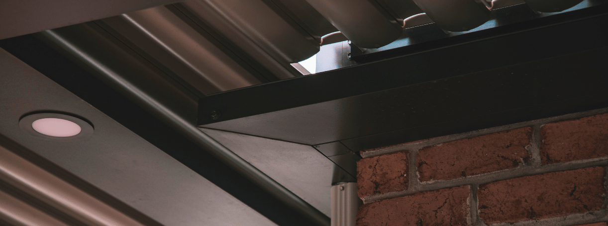 The Key to a Dry Patio: Pergola Gutter System