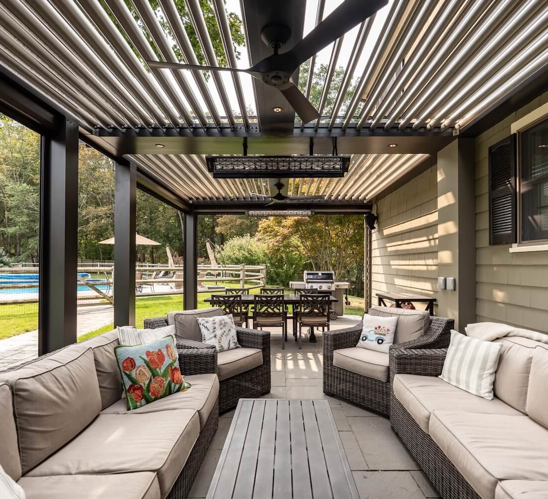 Underneath the Pergola X backyard patio with heaters, fans an comfort integrations