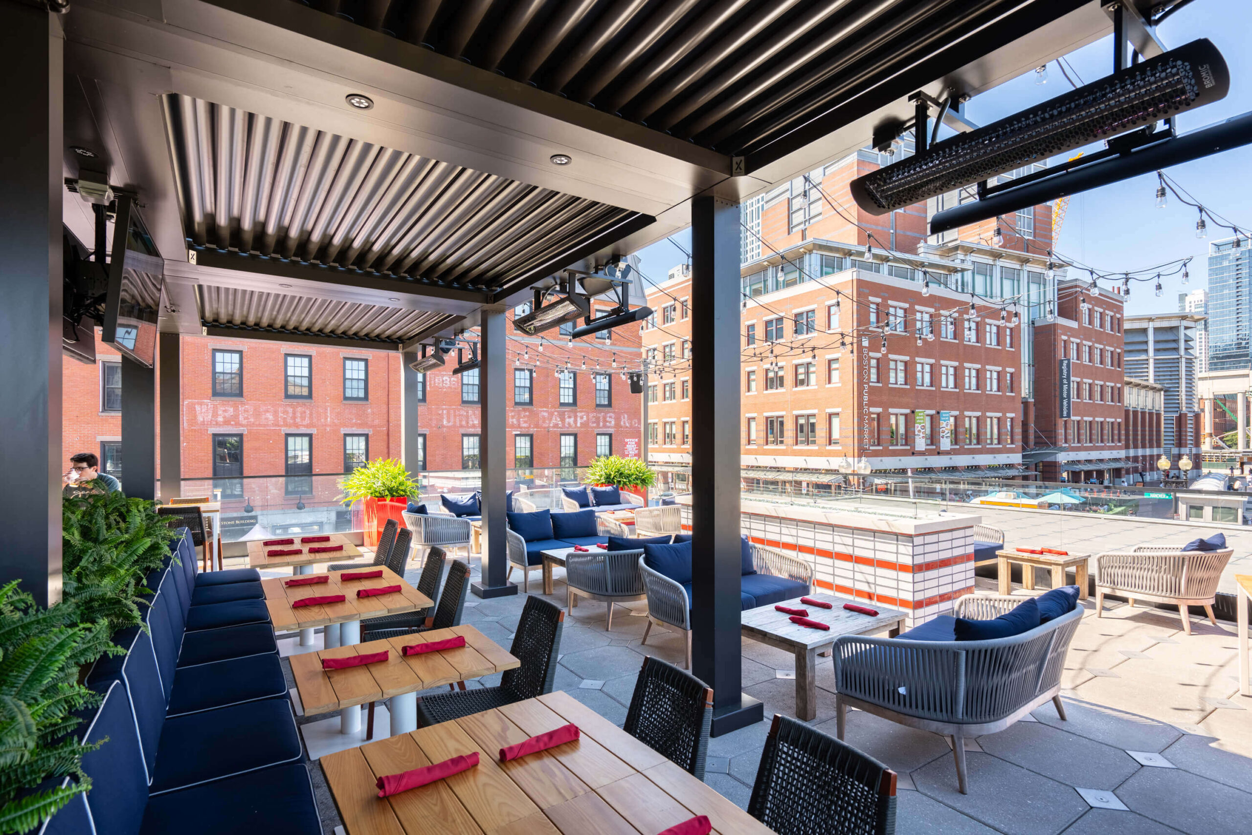 Eating area with Pergola X installed at Gordon Ramsey Burger with Boston views