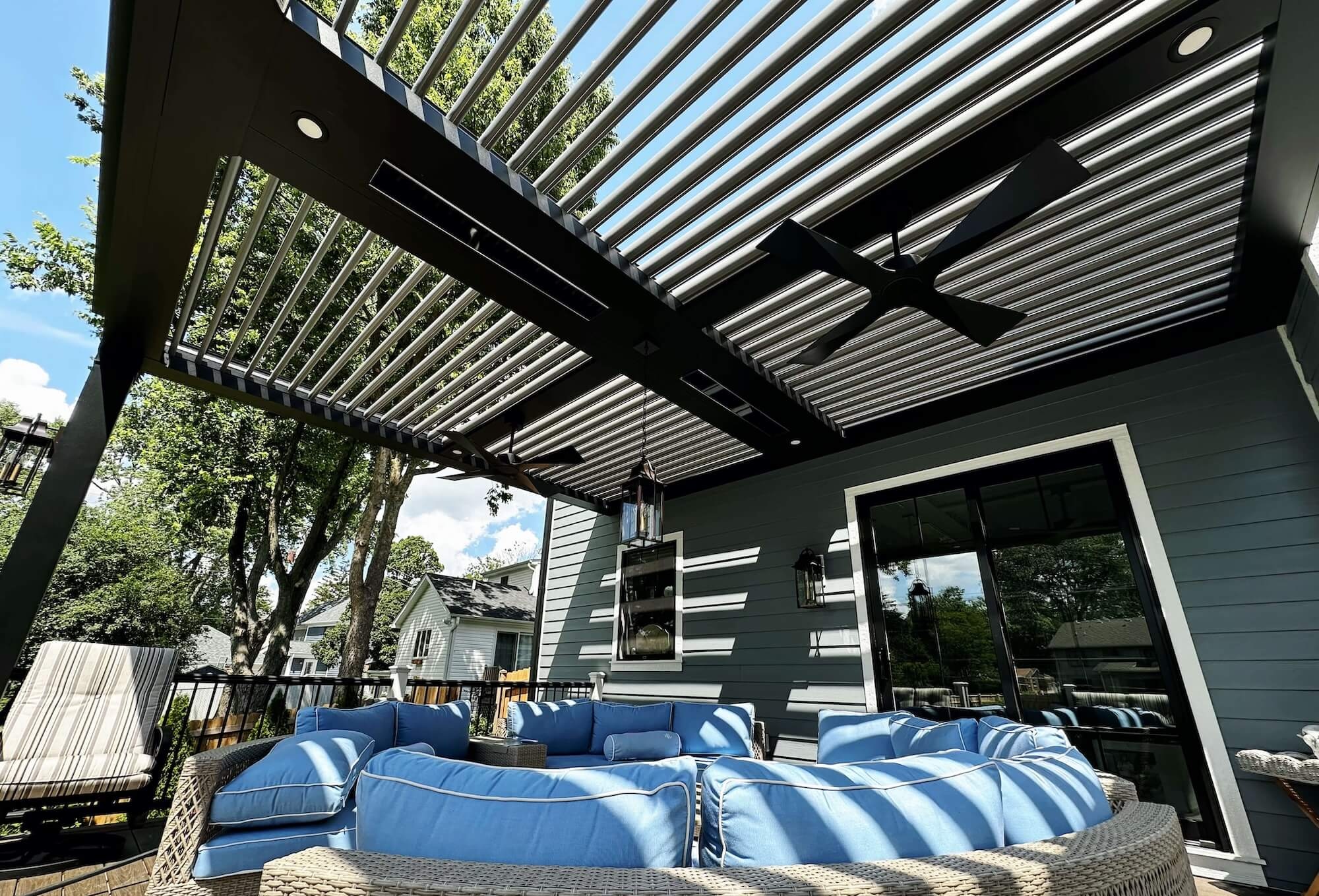 A StruXure motorized louvered pergola built over a back porch