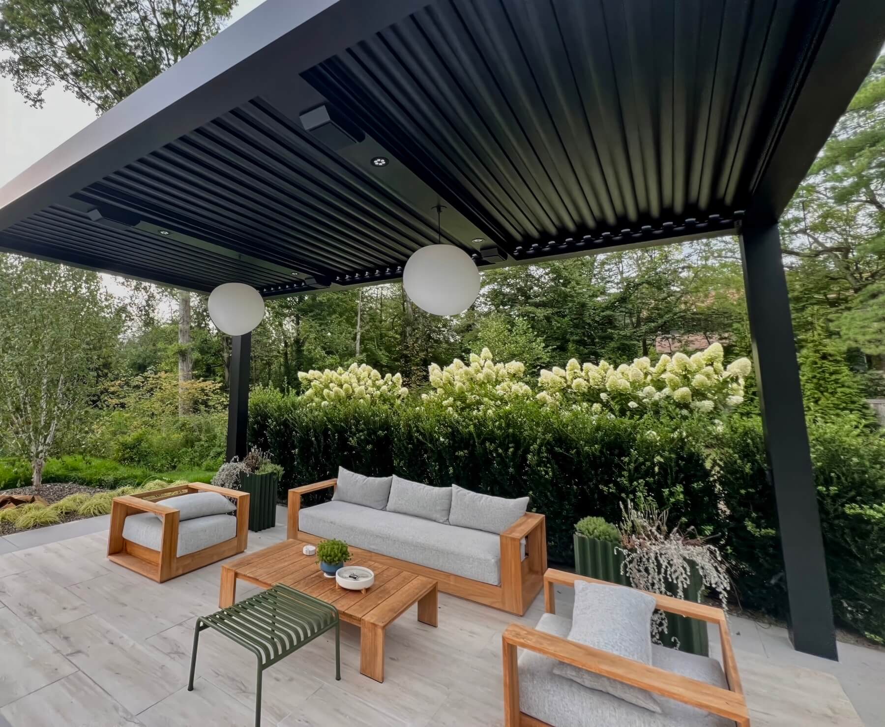 Black Pergola X with outdoor seating area