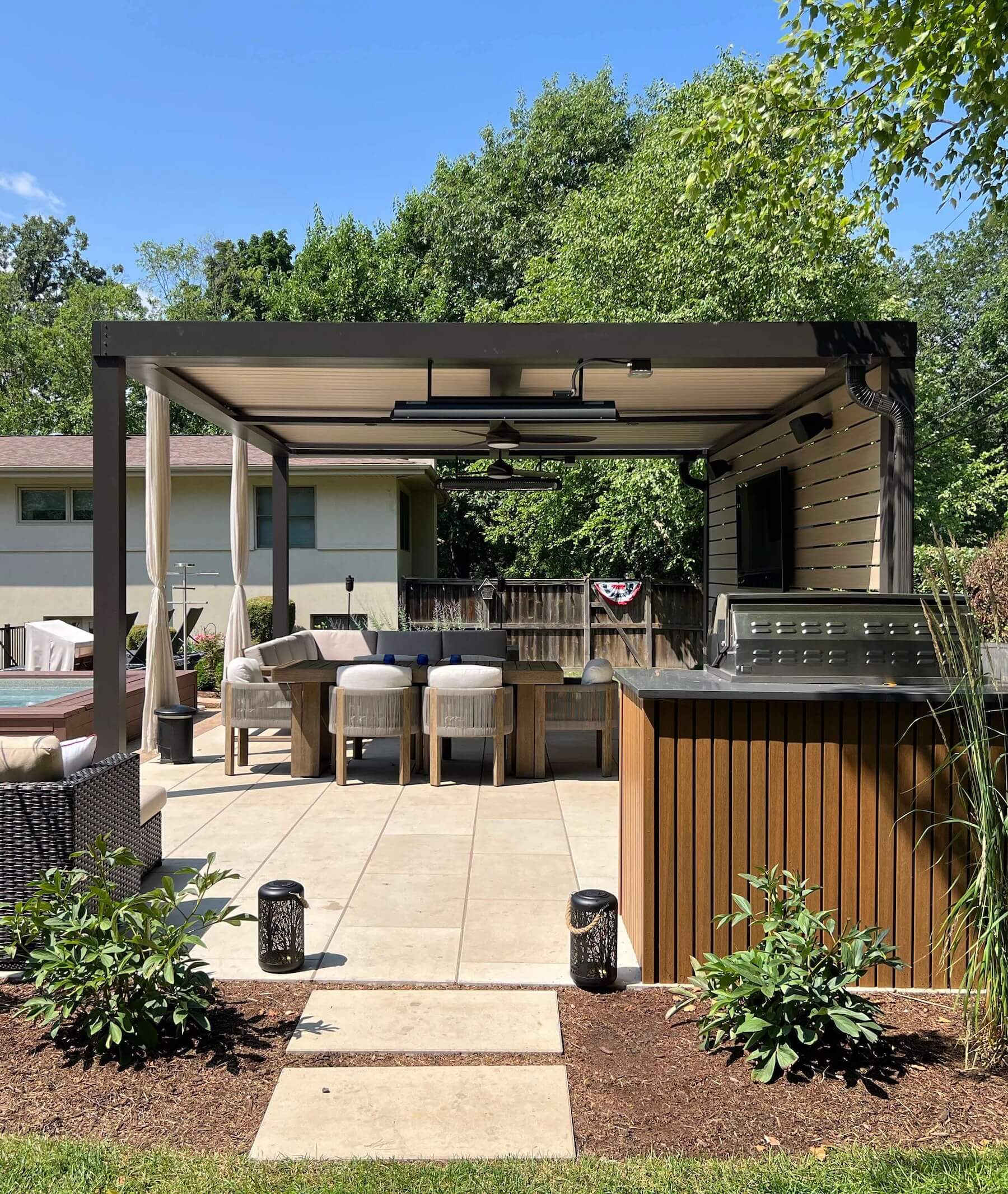 Pergola X poolside covering tv sitting area