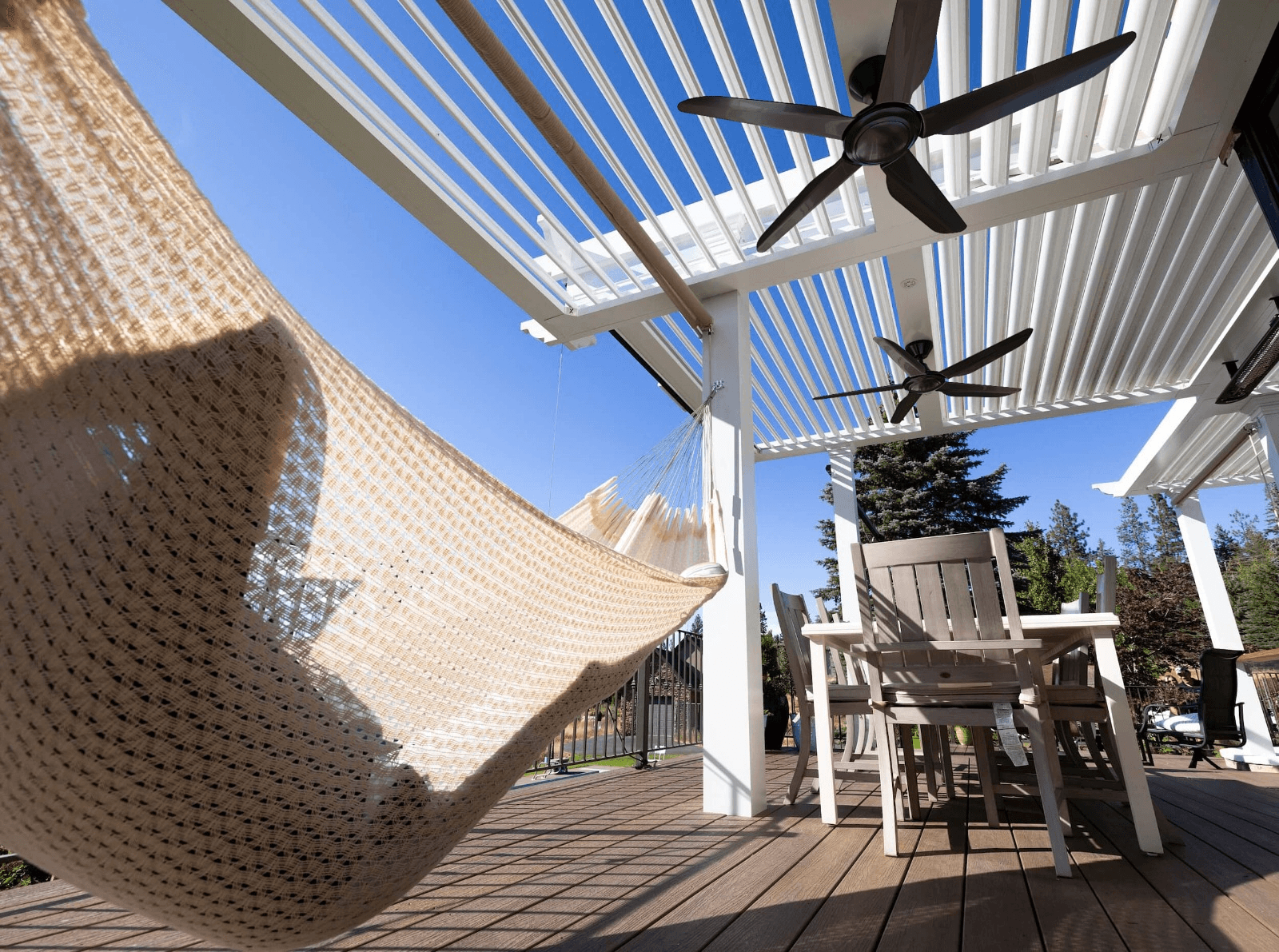 White Pergola X with custom fans and an attached pergola