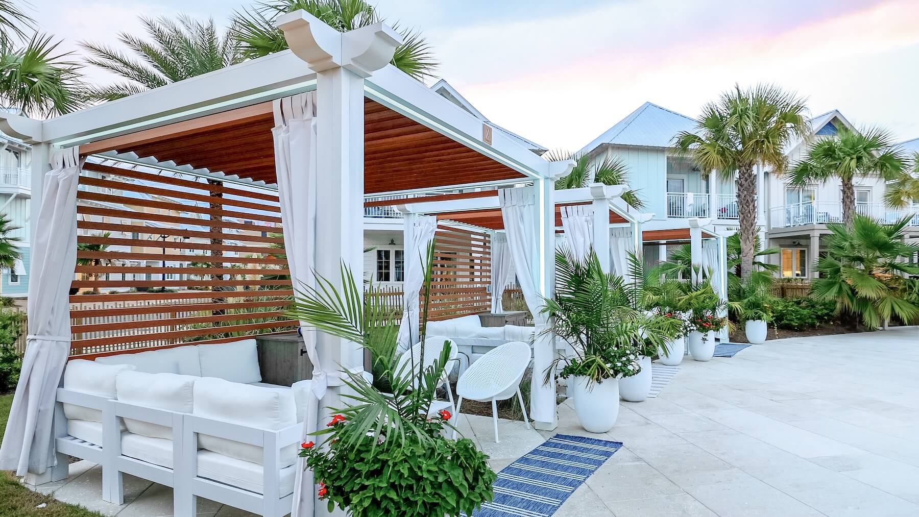 Margaritaville two tone white and wood grain Cabana X outdoor sitting area