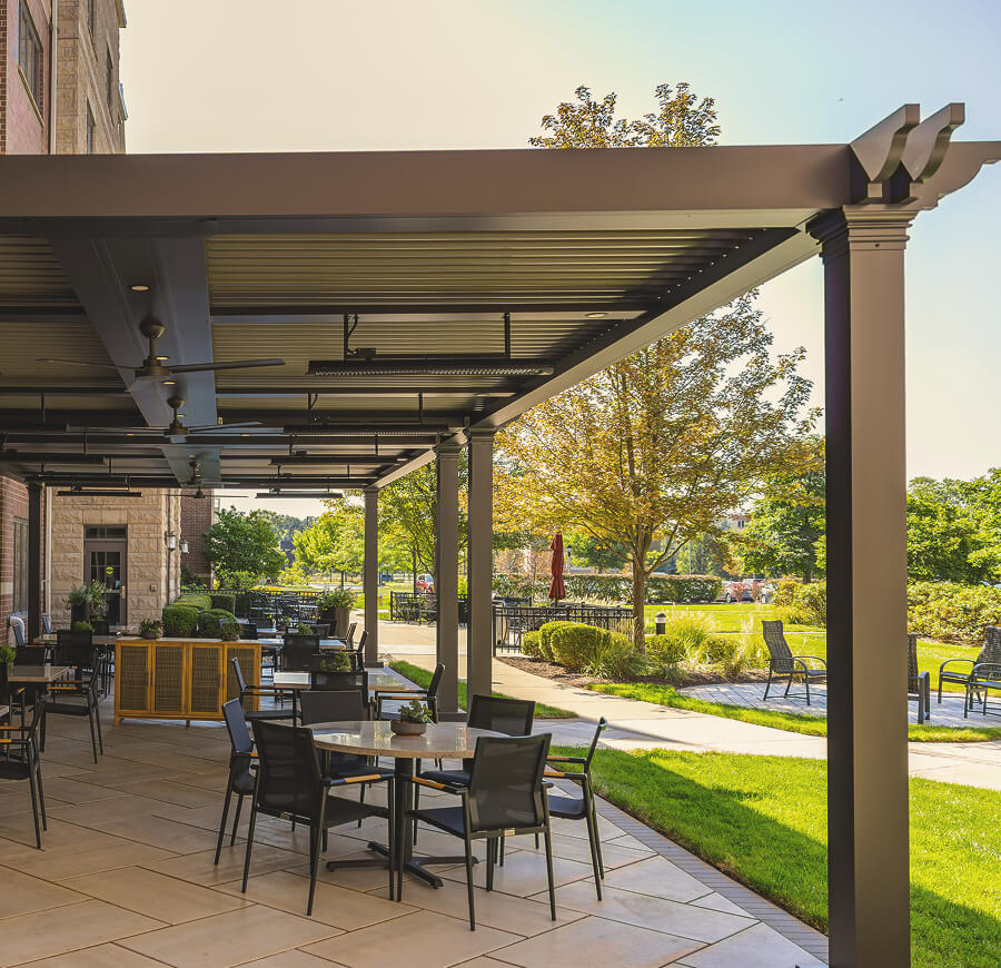 Bronze custom Pergola X over outdoor seating area