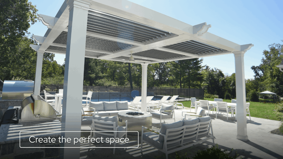 Large pergola covering an outdoor living area with lounge seating, dining space, and fire feature
